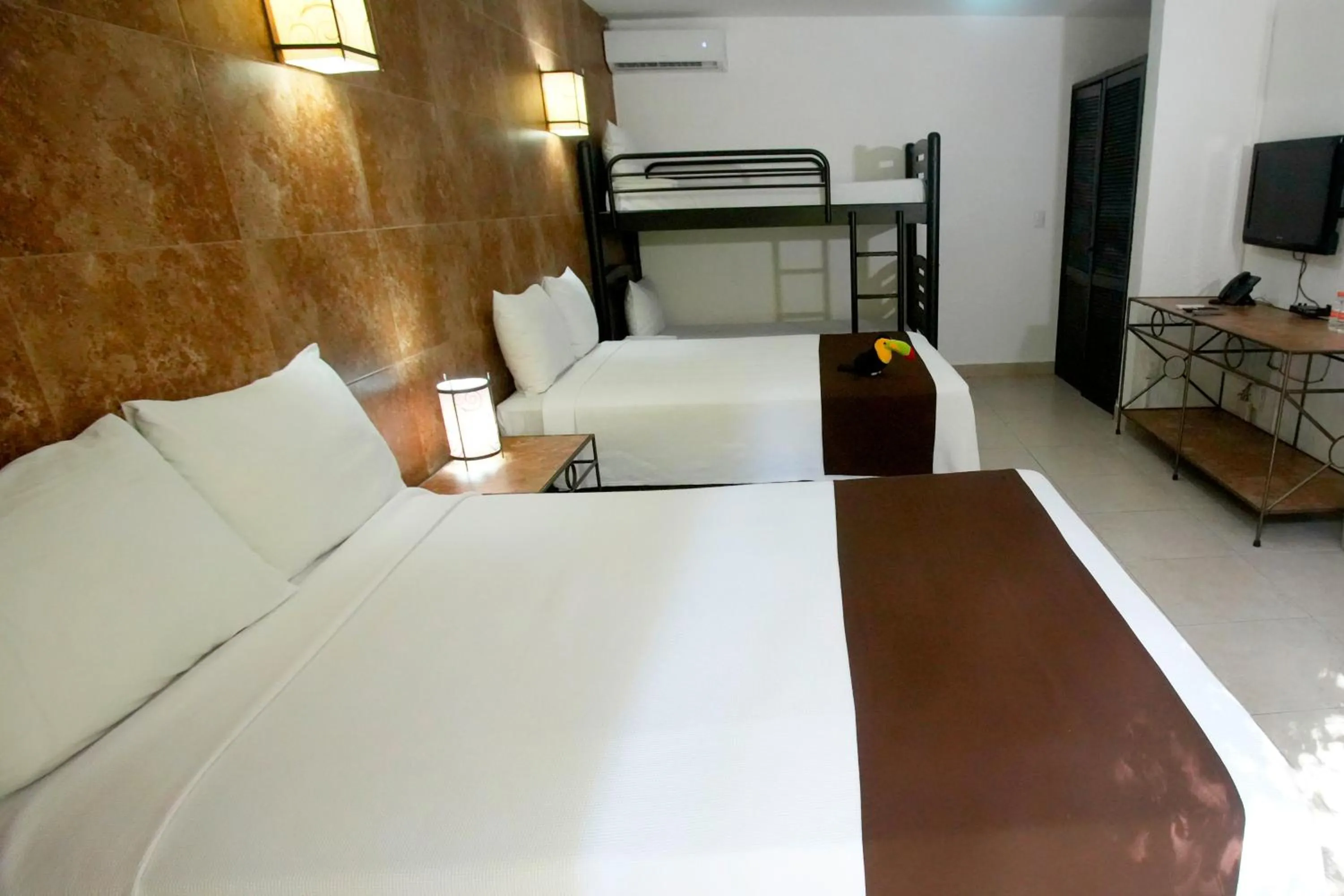 Photo of the whole room, Bed in Tukan Hotel Playa del Carmen