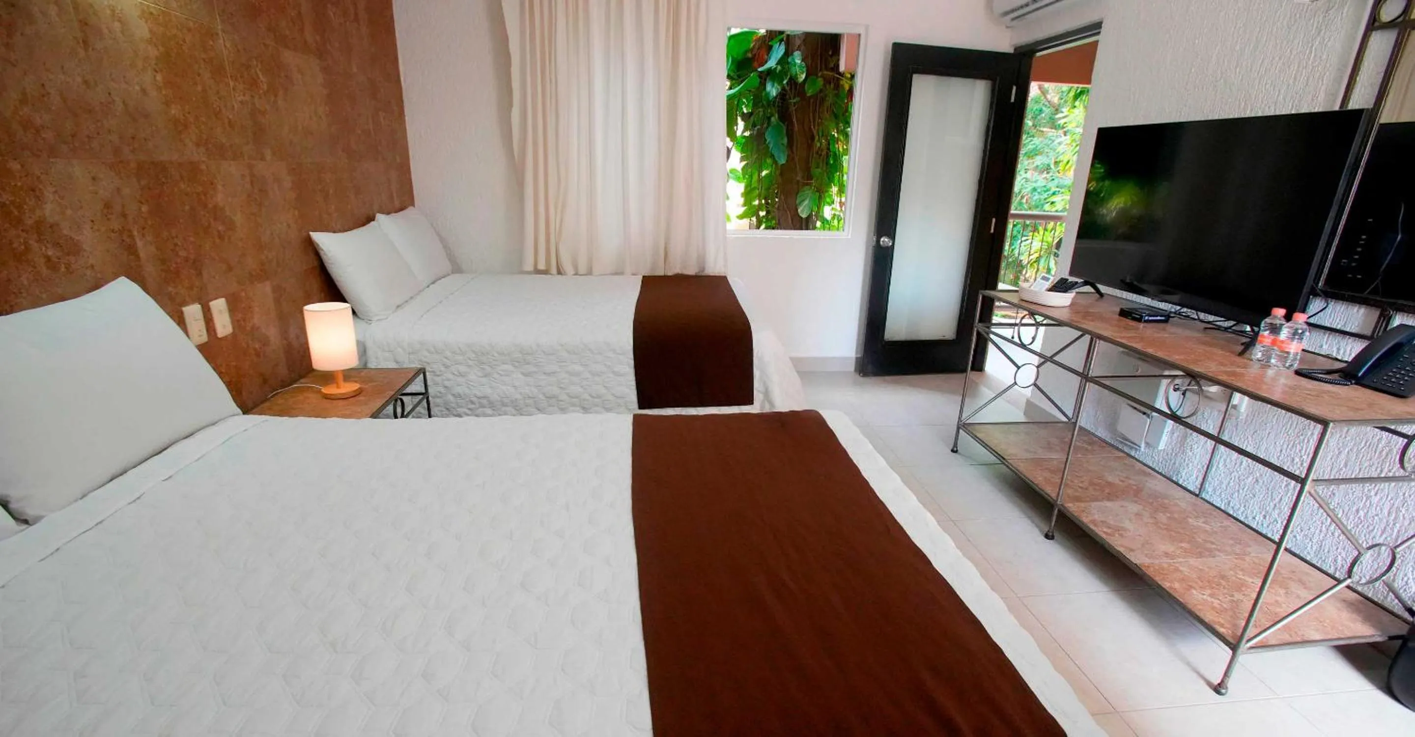 Bed in Tukan Hotel Playa del Carmen