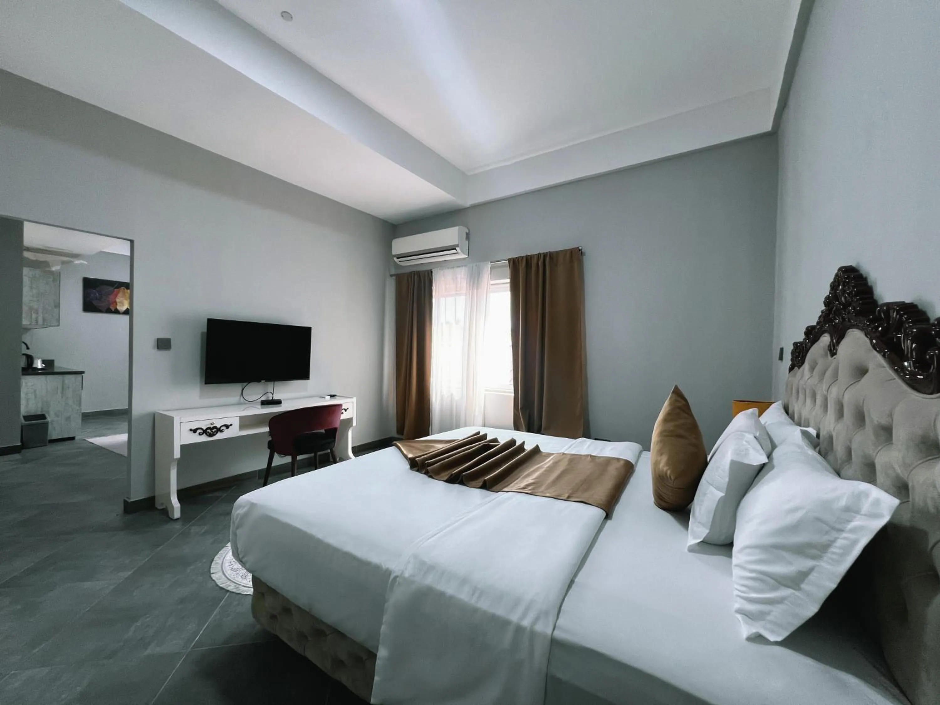 Bed in Euro Homes Hotel