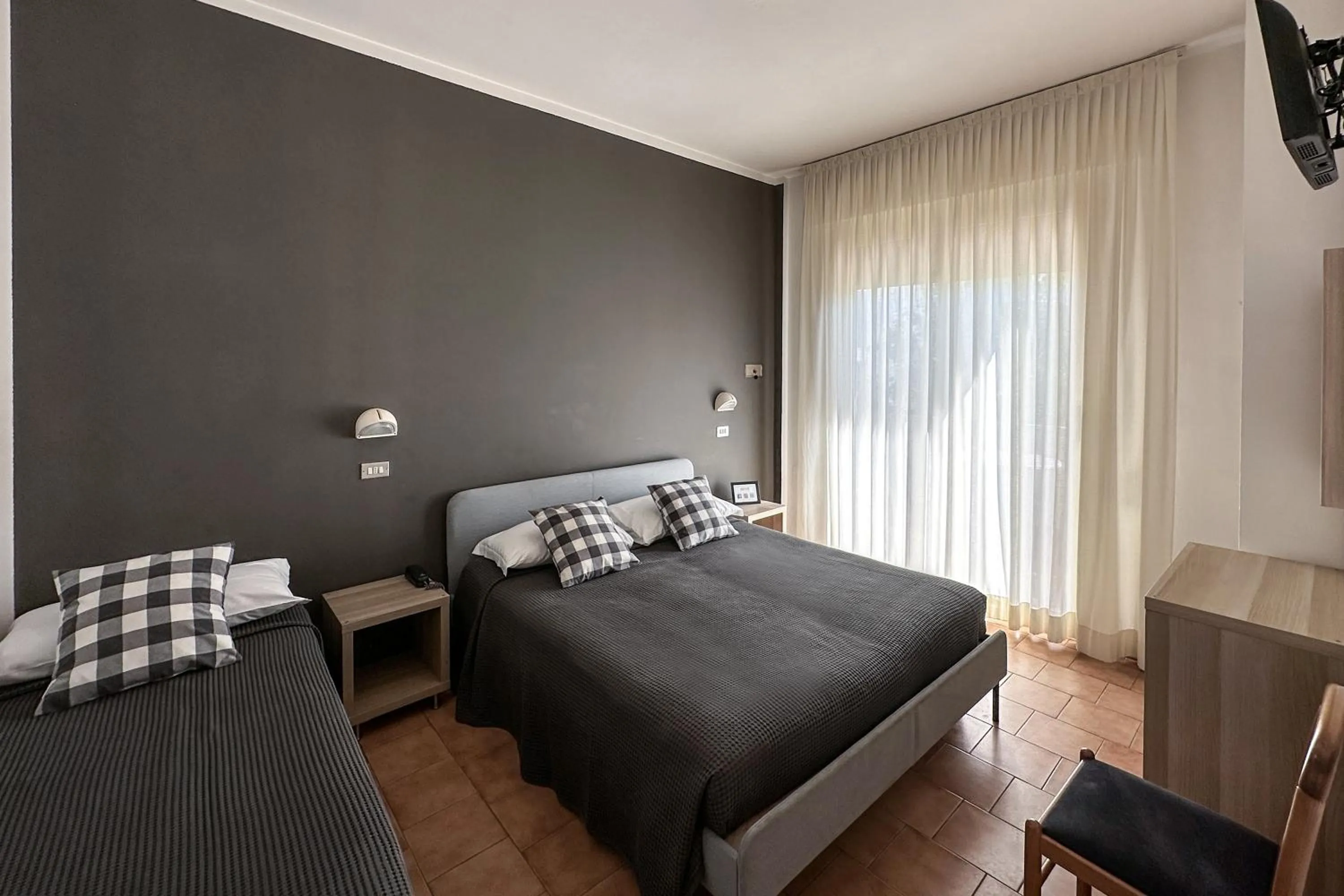 Bed in Hotel Aplo - Breakfast Experience