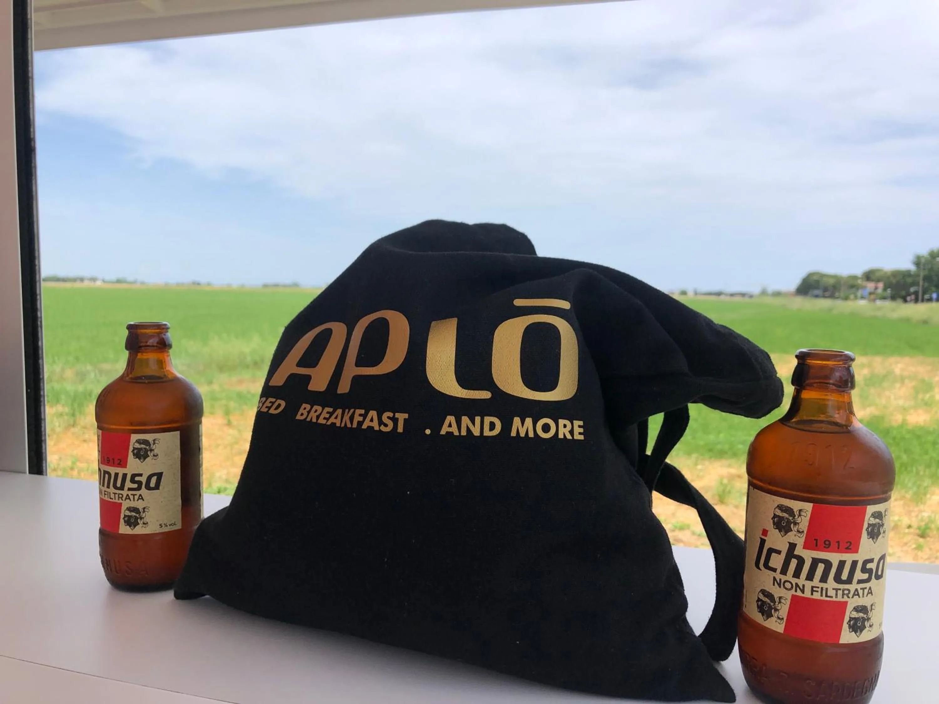 Property logo or sign in Hotel Aplo - Breakfast Experience