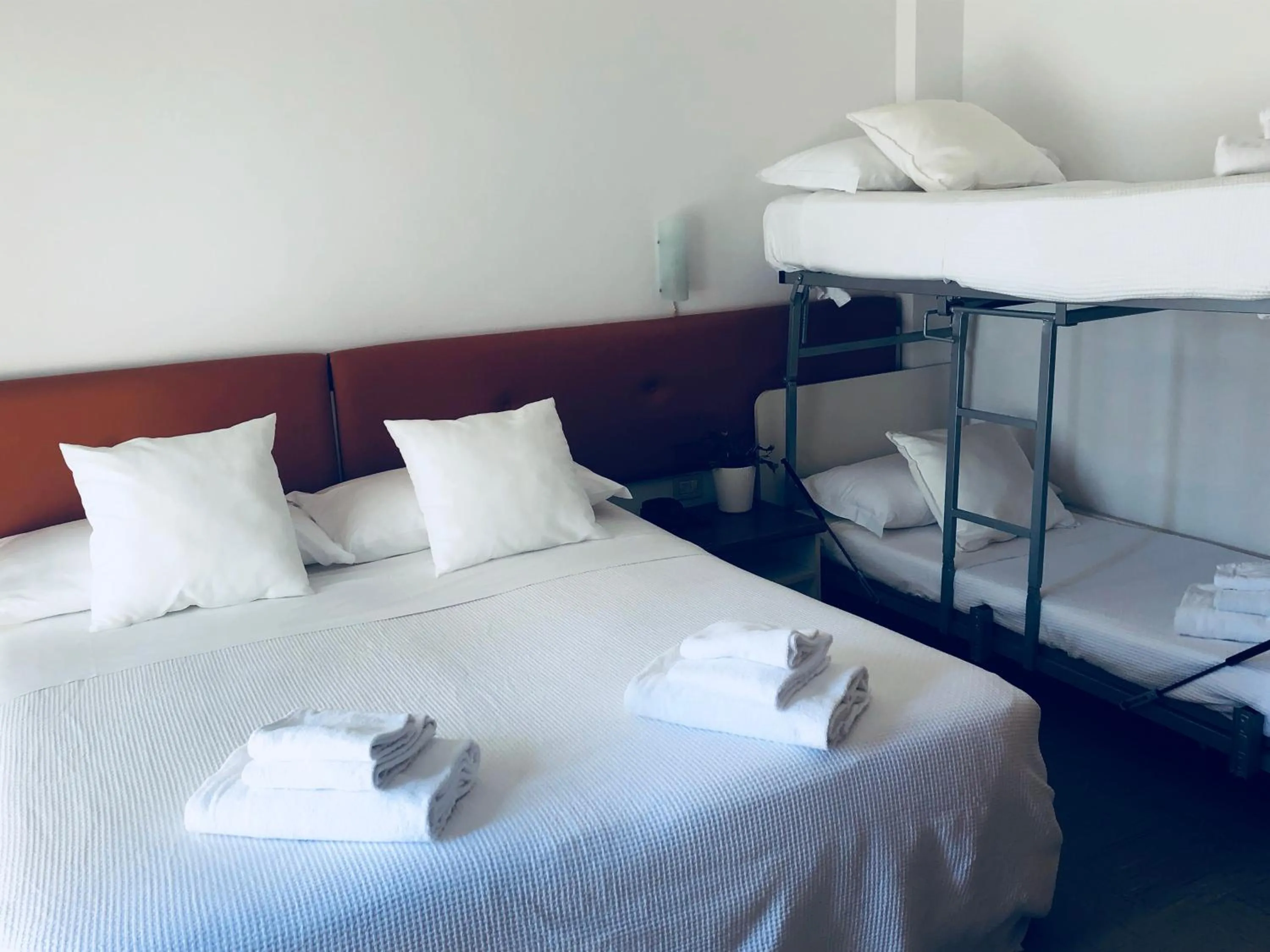 Bed in Hotel Aplo - Breakfast Experience