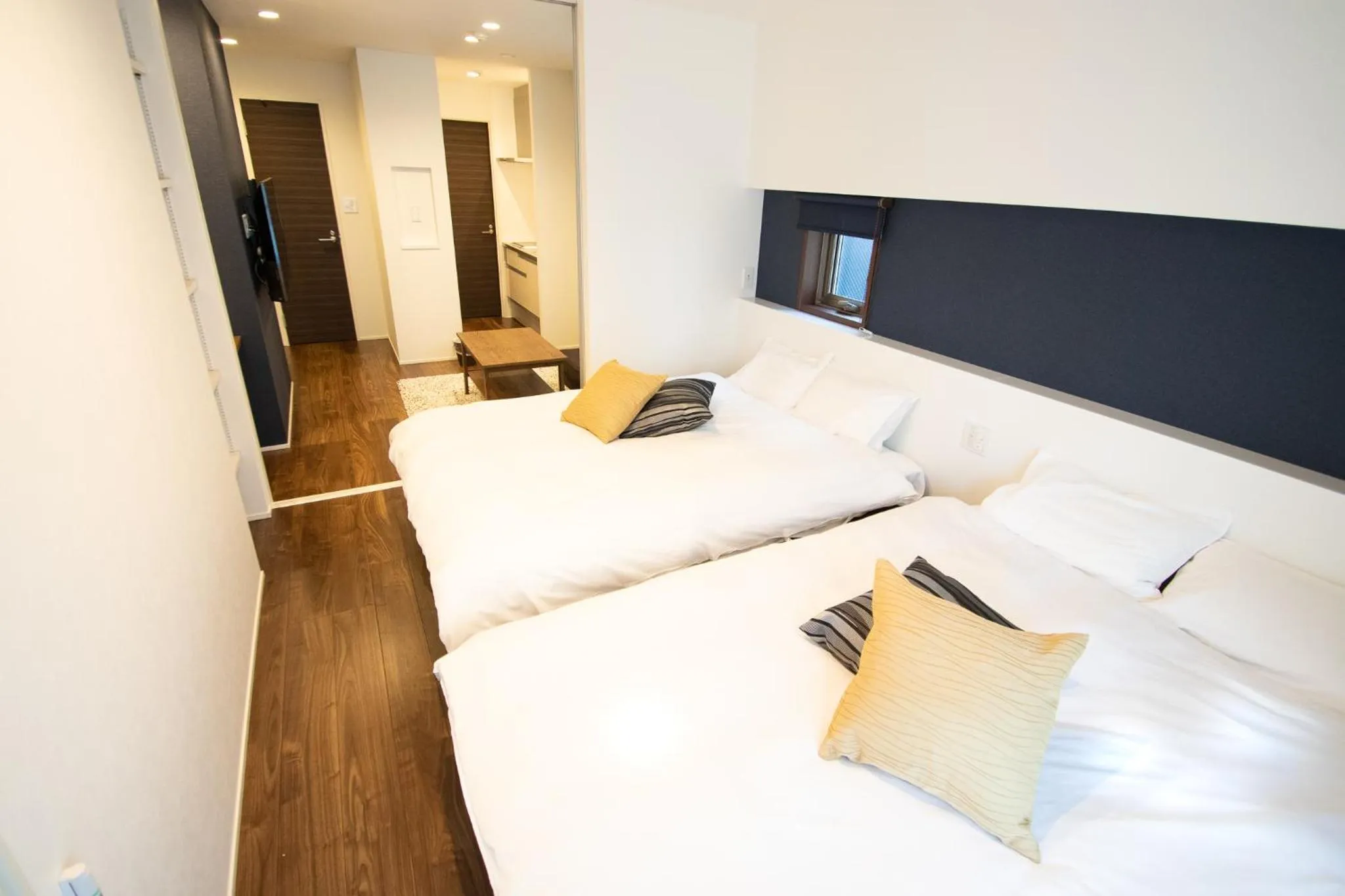 Bed in Apartment Hotel Tenjin TUMUGU