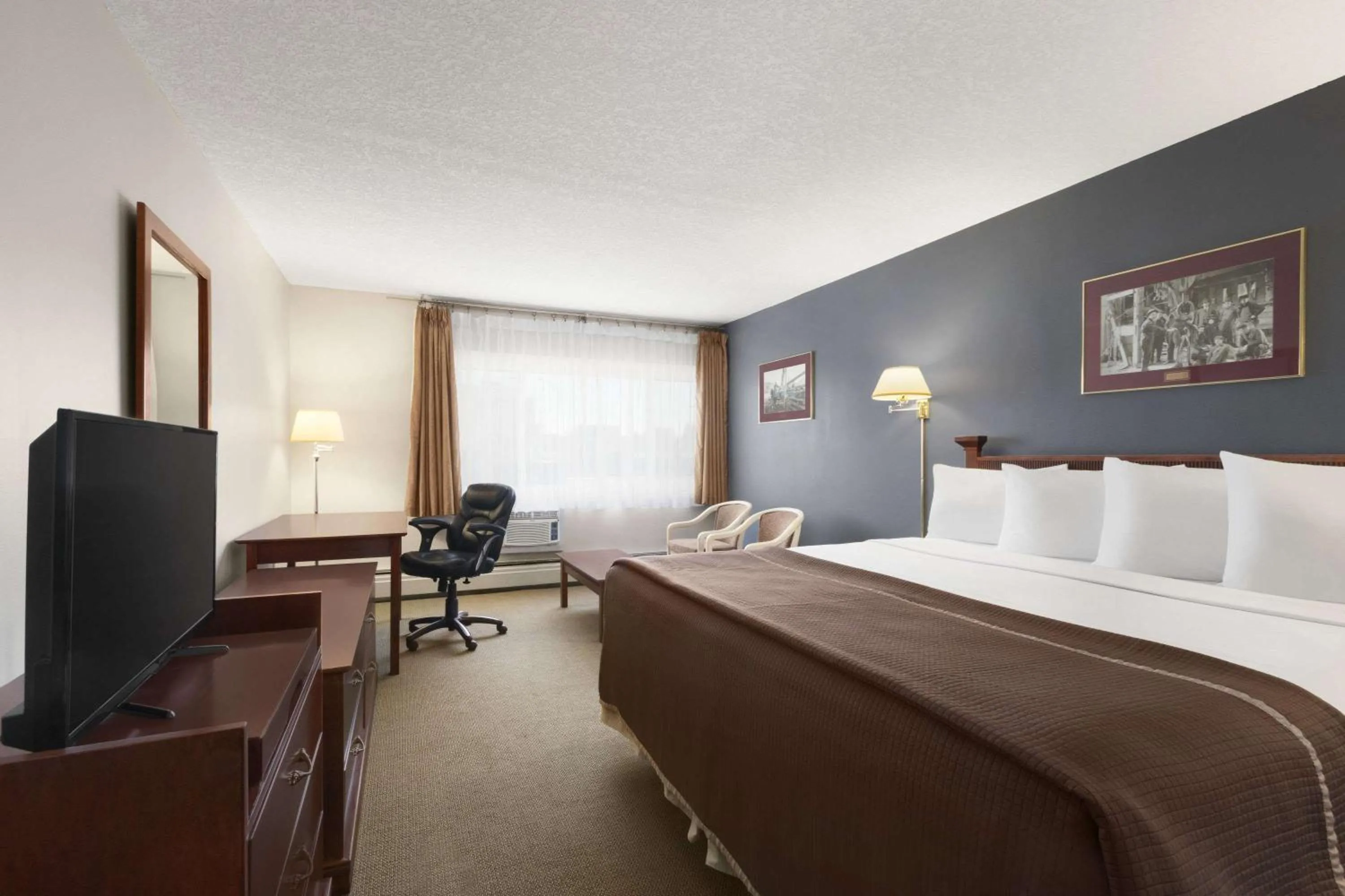 Bedroom in Travelodge by Wyndham Calgary South