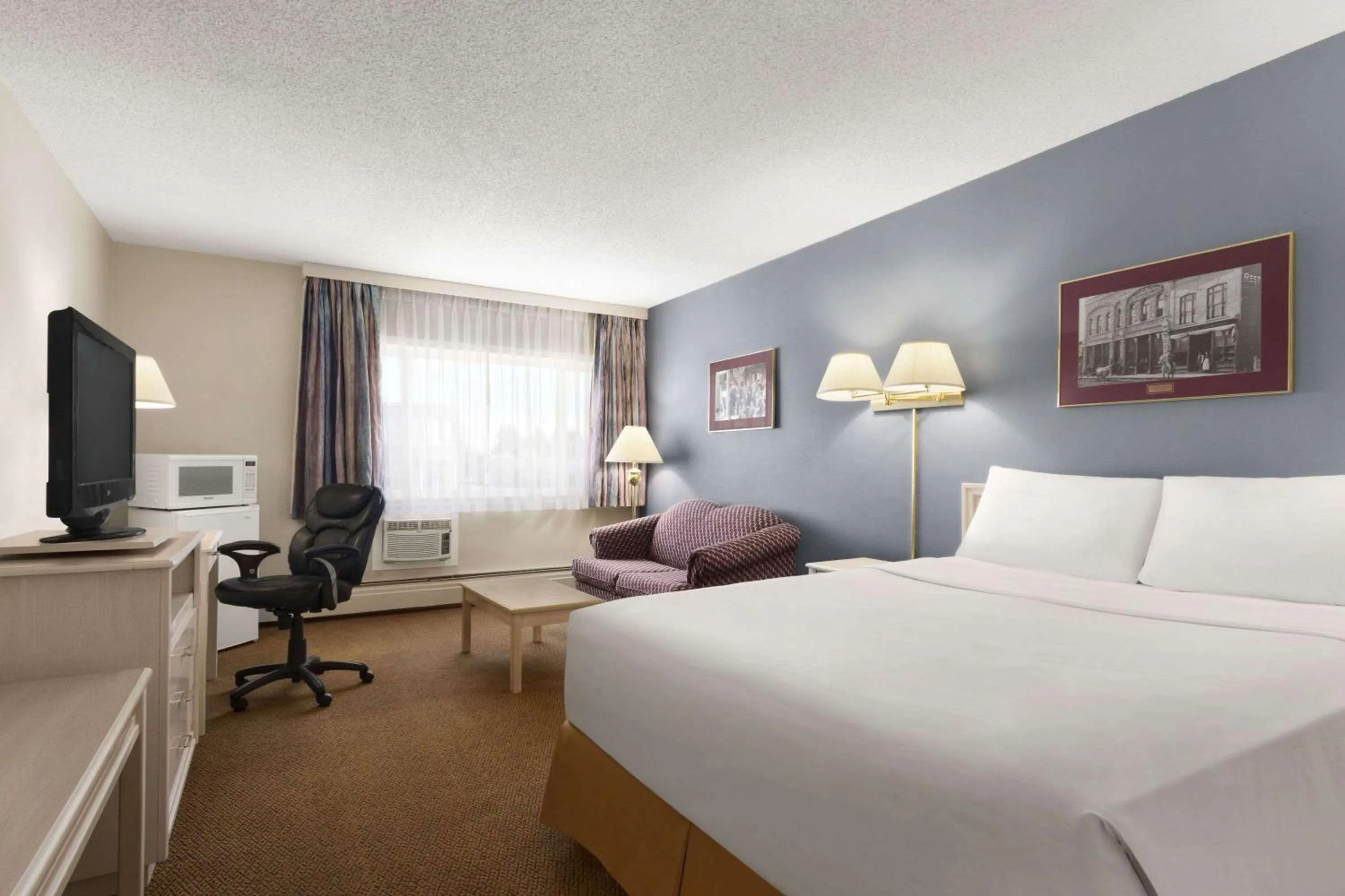 Bedroom in Travelodge by Wyndham Calgary South