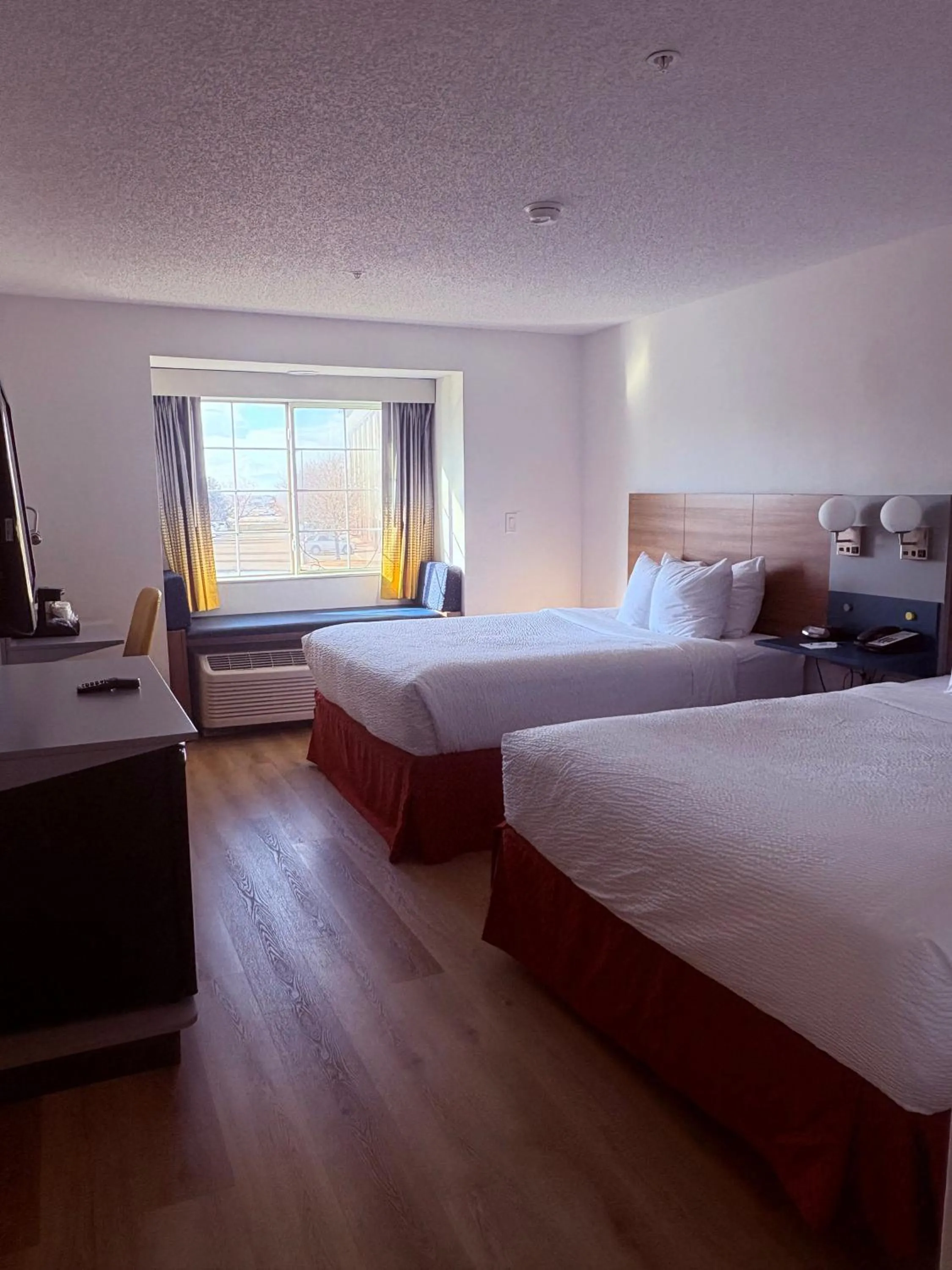 Bed in Microtel Inn & Suites by Wyndham Denver Airport