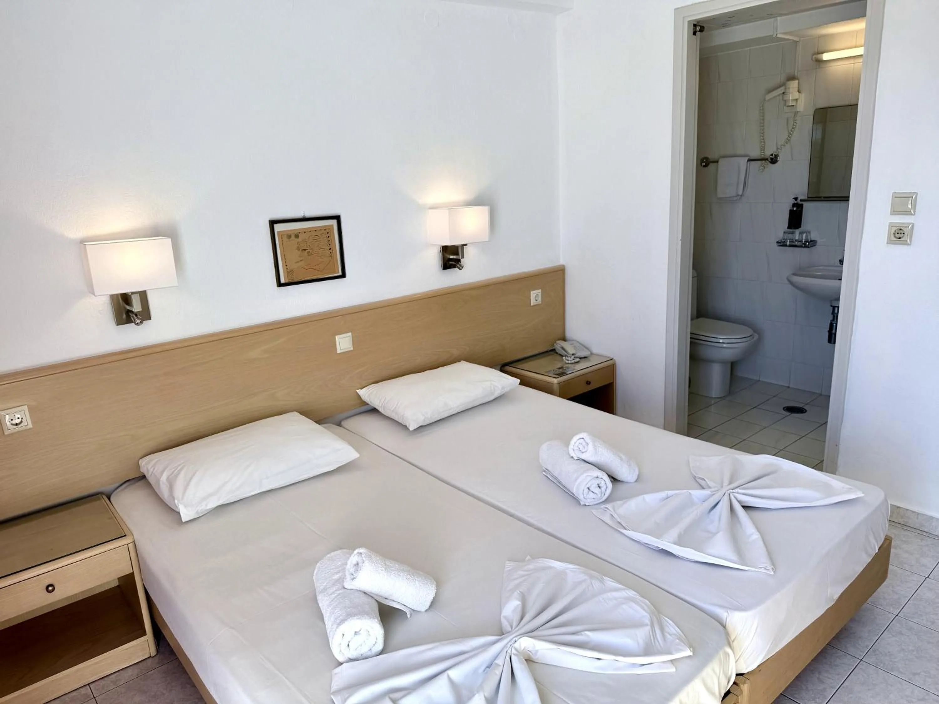 Bed in Savoy City Hotel