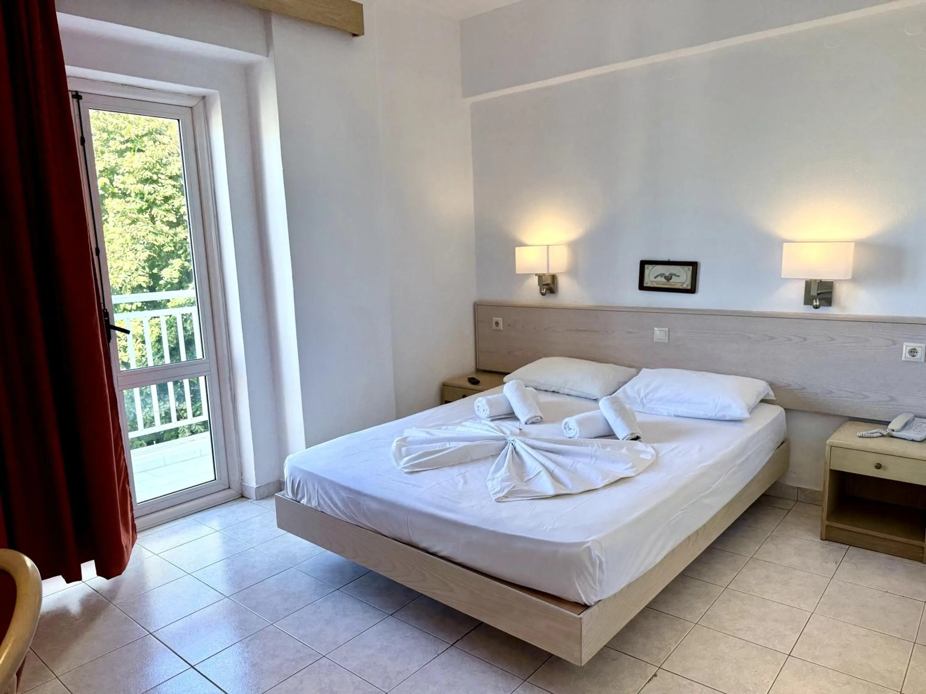 Bed in Savoy City Hotel