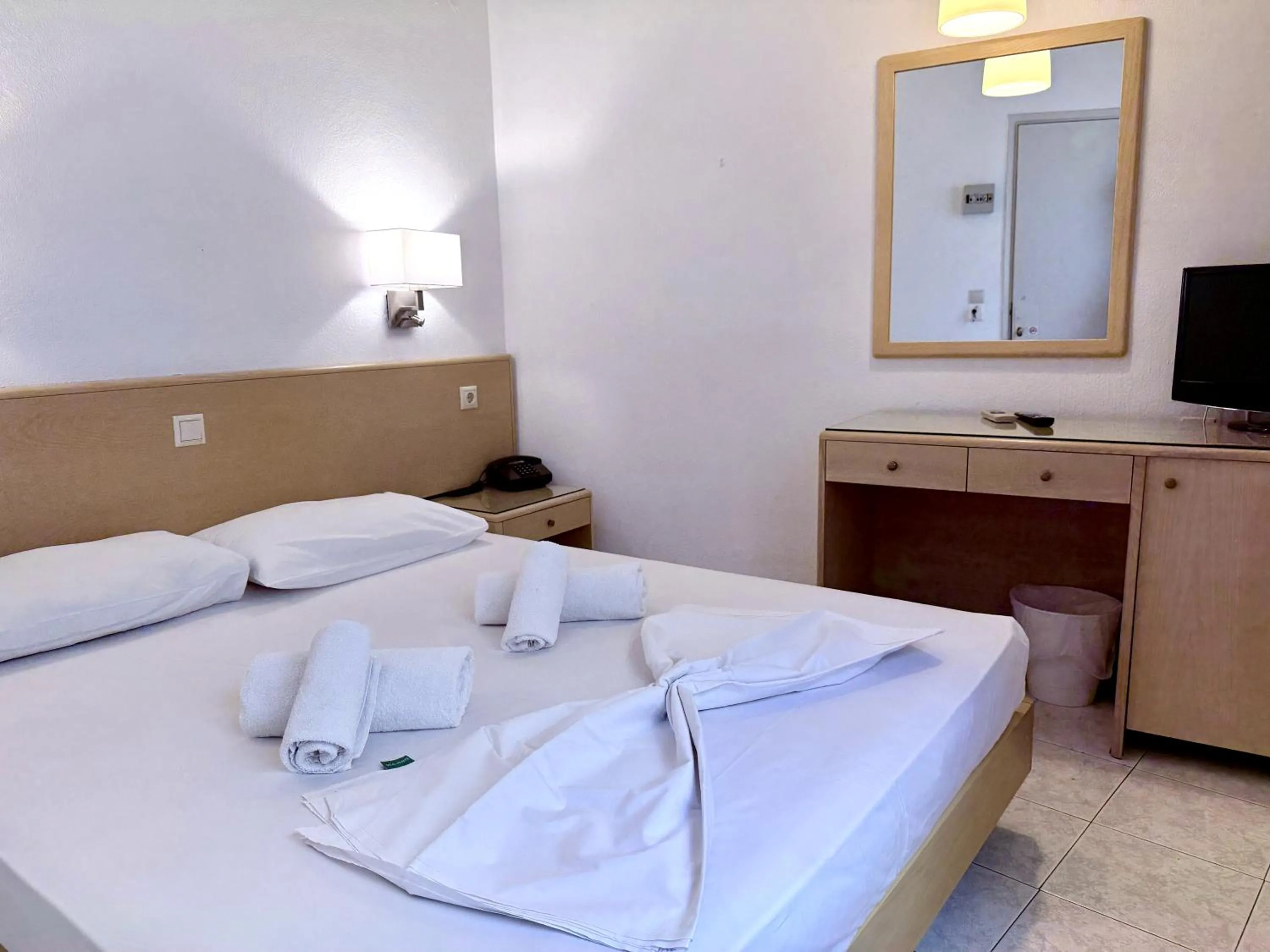 Bed in Savoy City Hotel