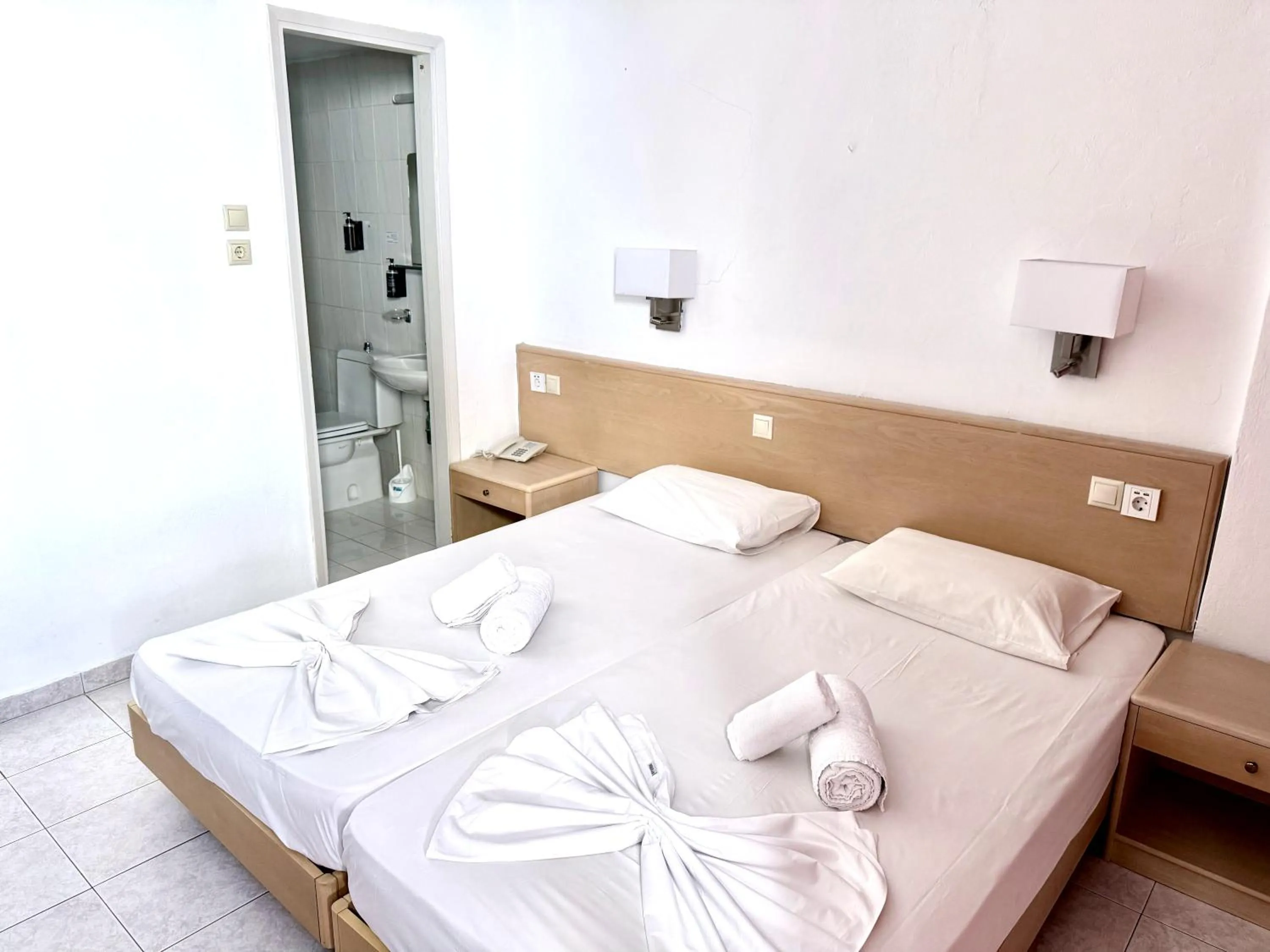 Bed in Savoy City Hotel