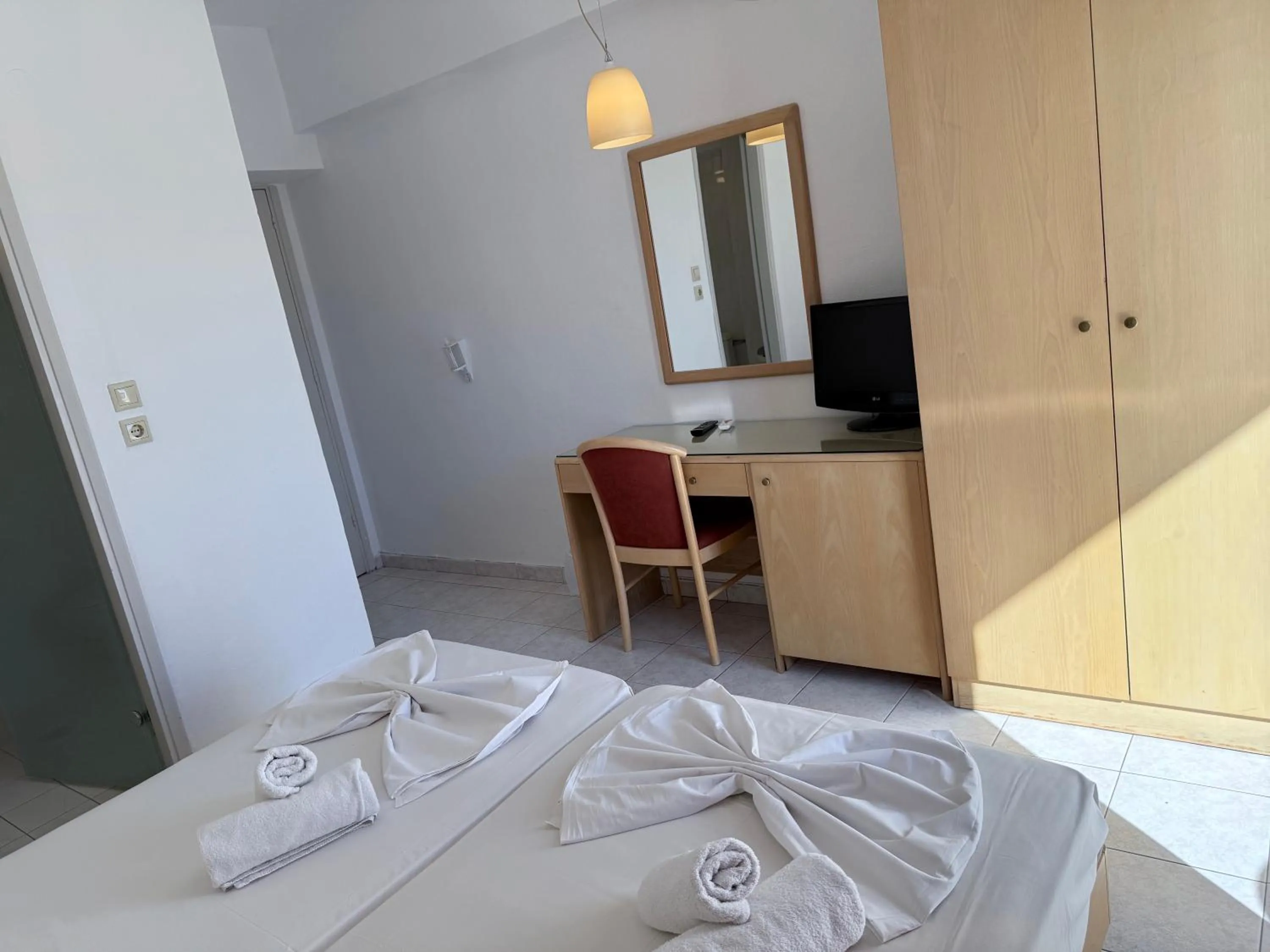 Bed in Savoy City Hotel