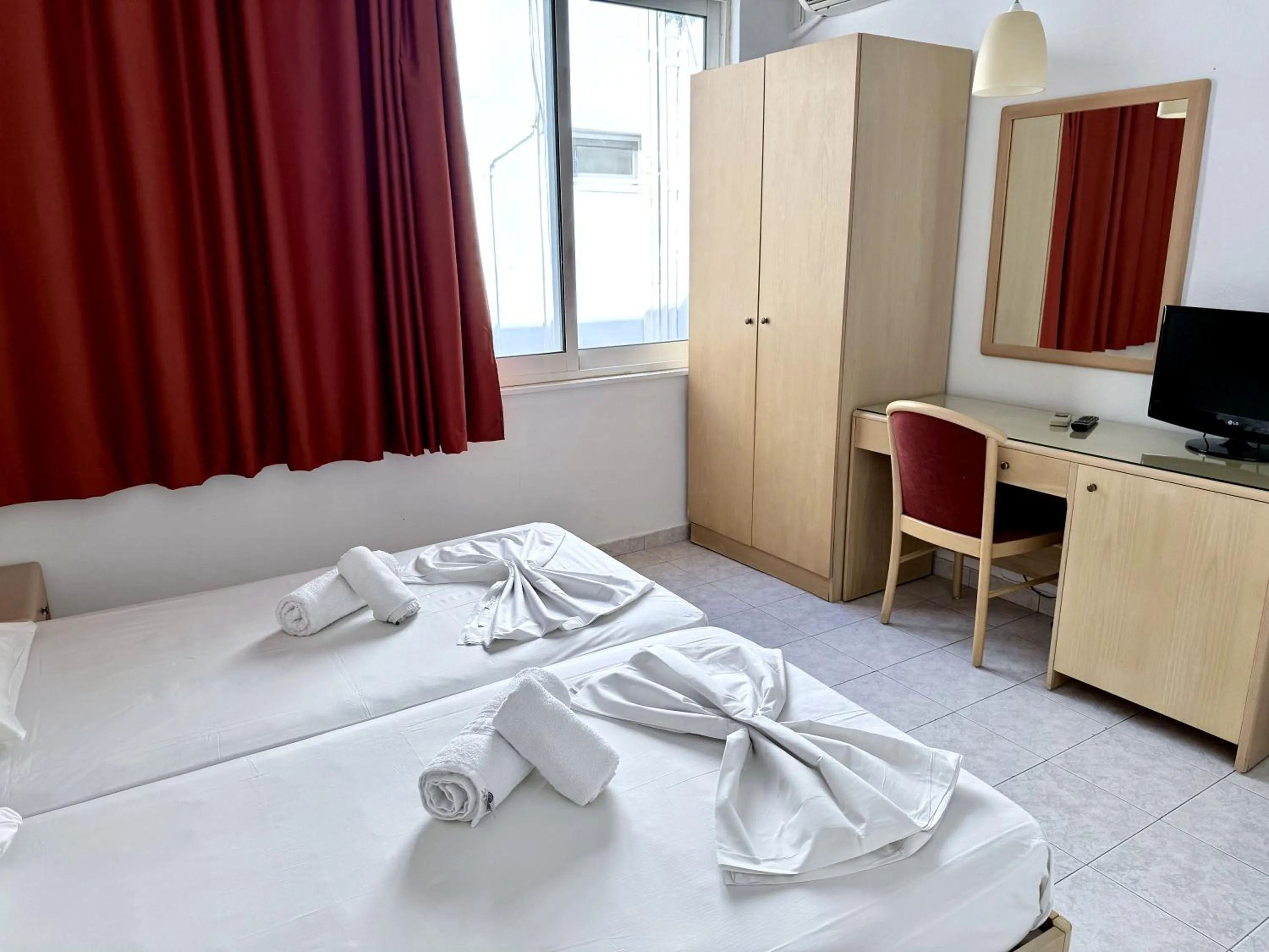 Bed in Savoy City Hotel