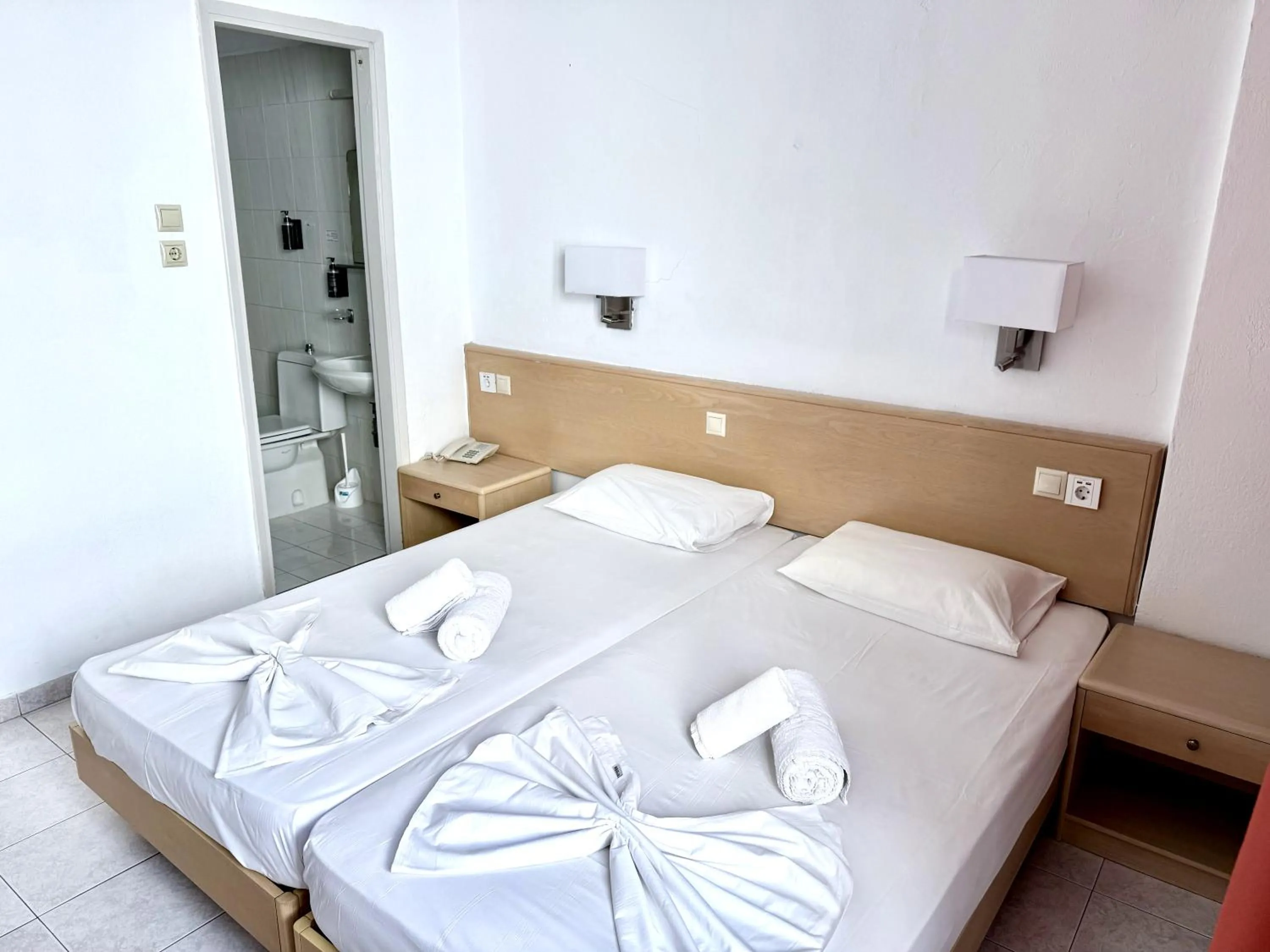 Bed in Savoy City Hotel