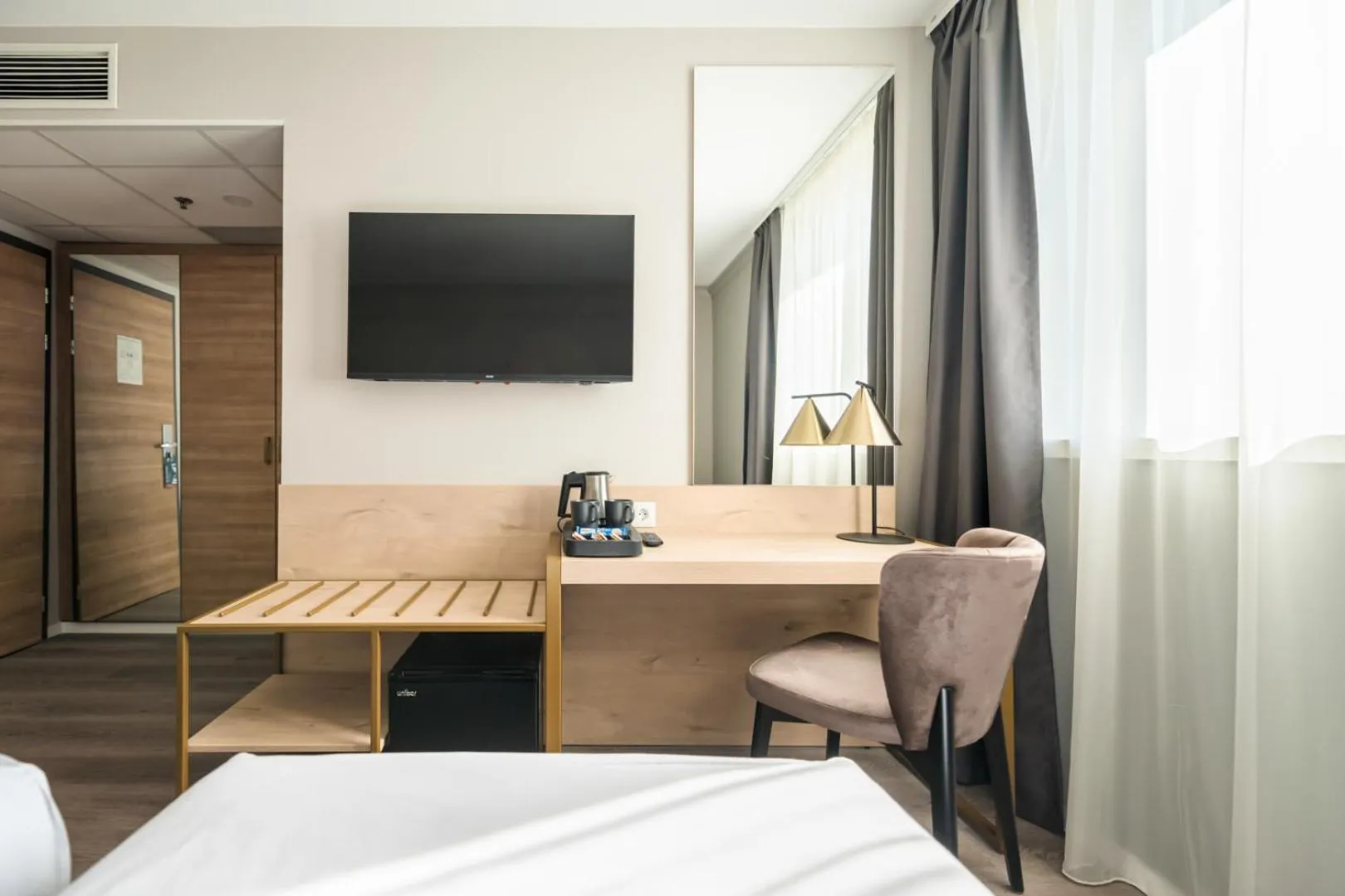 Seating area, Bed in Expo Tower by Mellow Mood Hotels