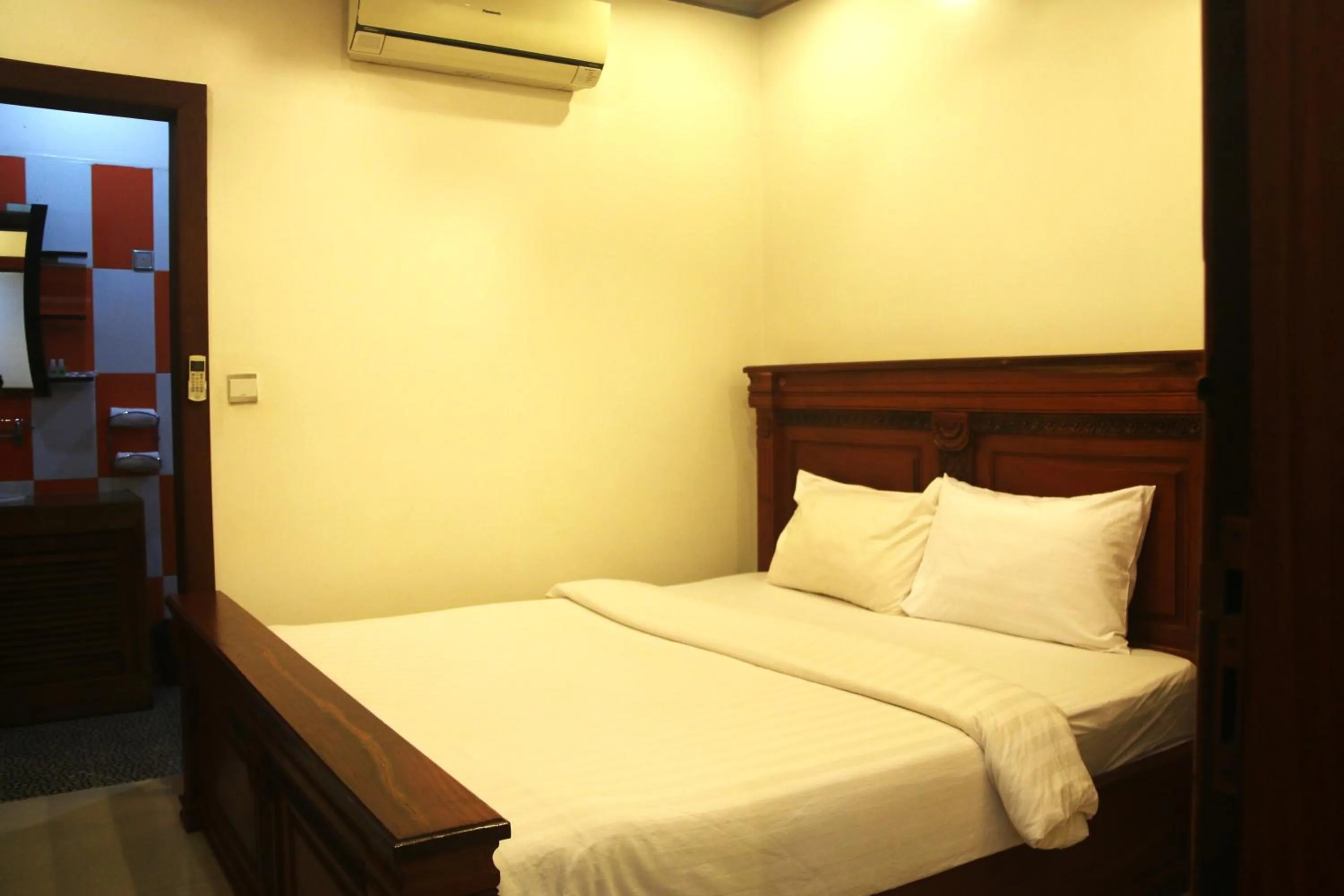 Bed in Shining Angkor Apartment Hotel