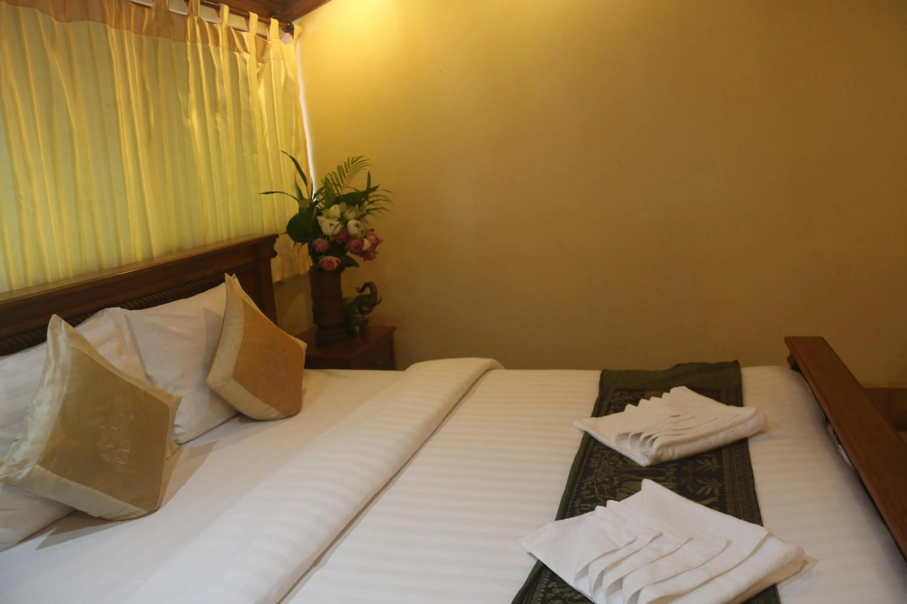 Bed in Shining Angkor Apartment Hotel