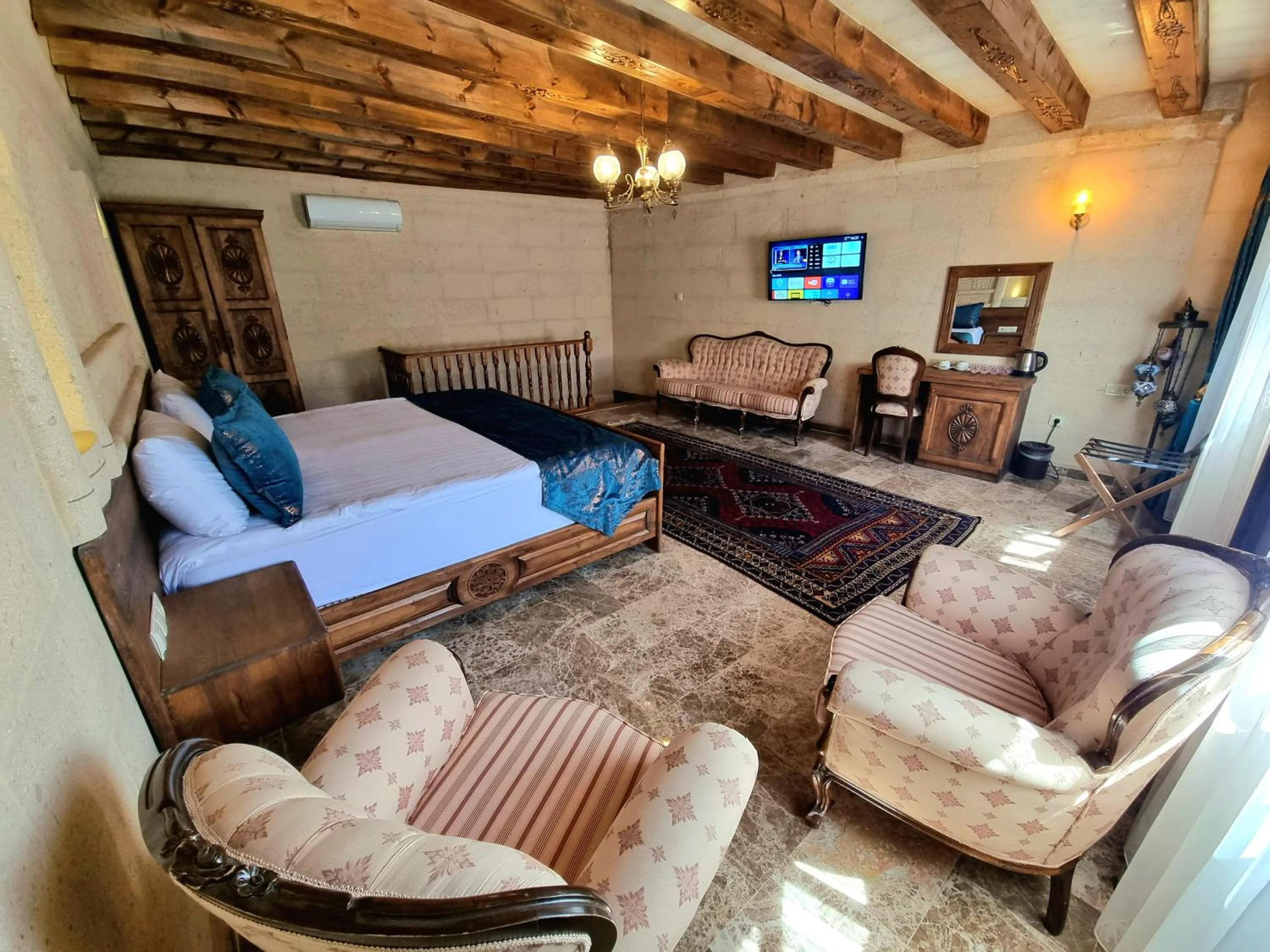 Living room, Bed in Cappadocia Caves Hotel