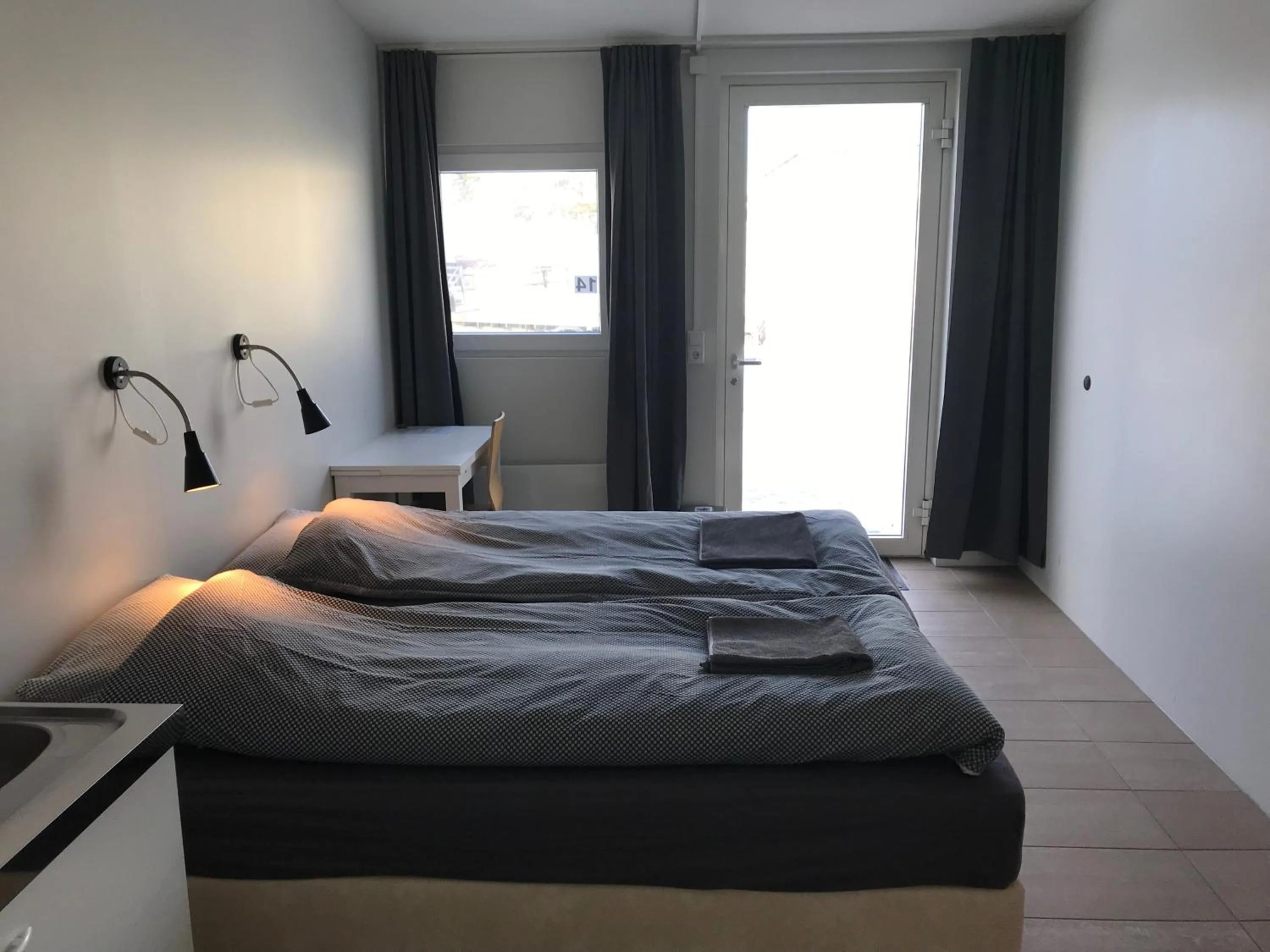 Bed in Lækjarkot Rooms and Cottages with Kitchen