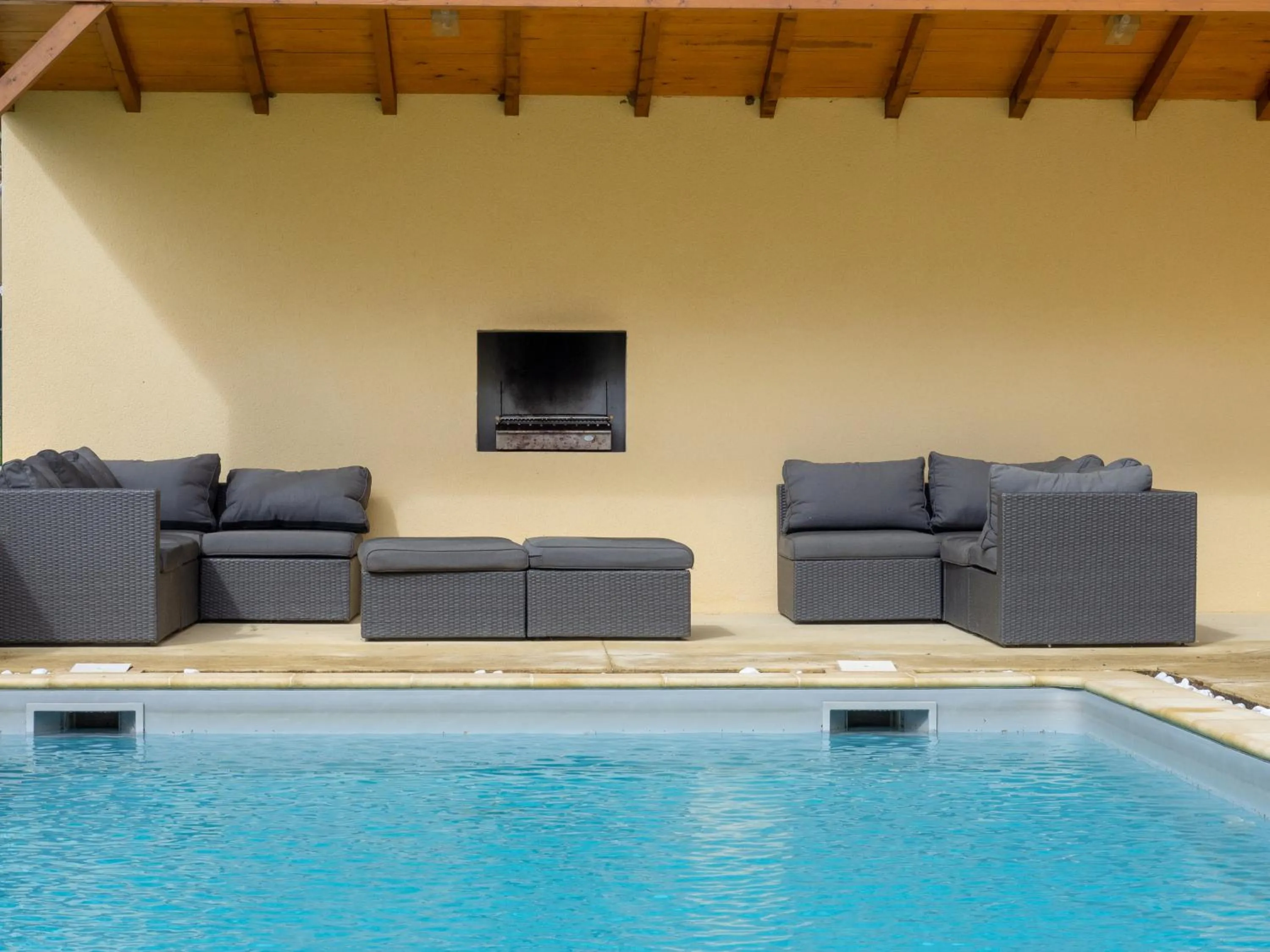 Swimming pool in Château Les Merles et ses Villas