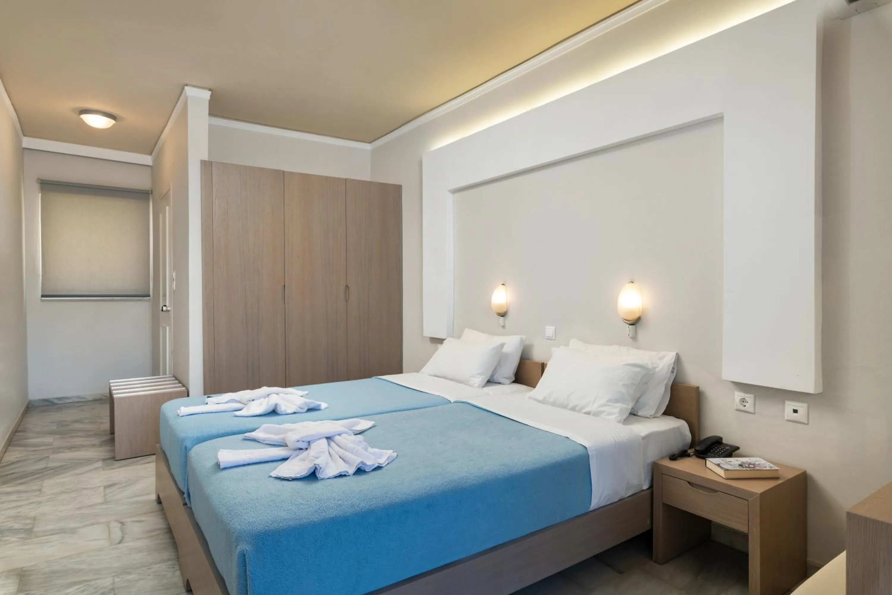 Bed in Hotel Haris on the beach