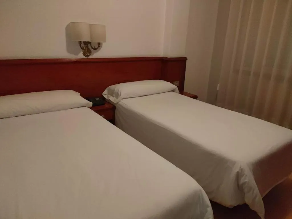 Bed in Hotel Maycar