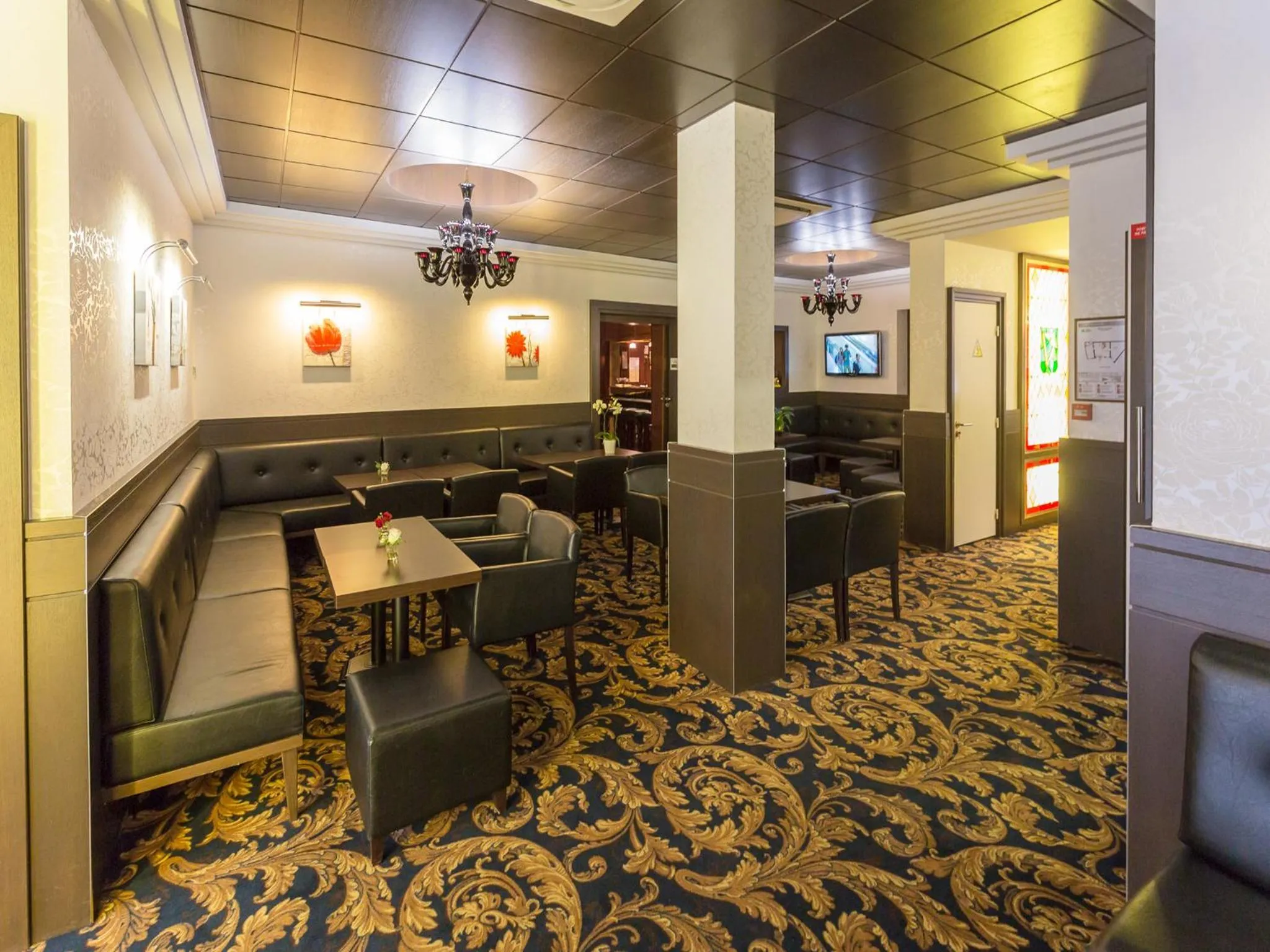 Communal lounge/ TV room in Hôtel Irlande