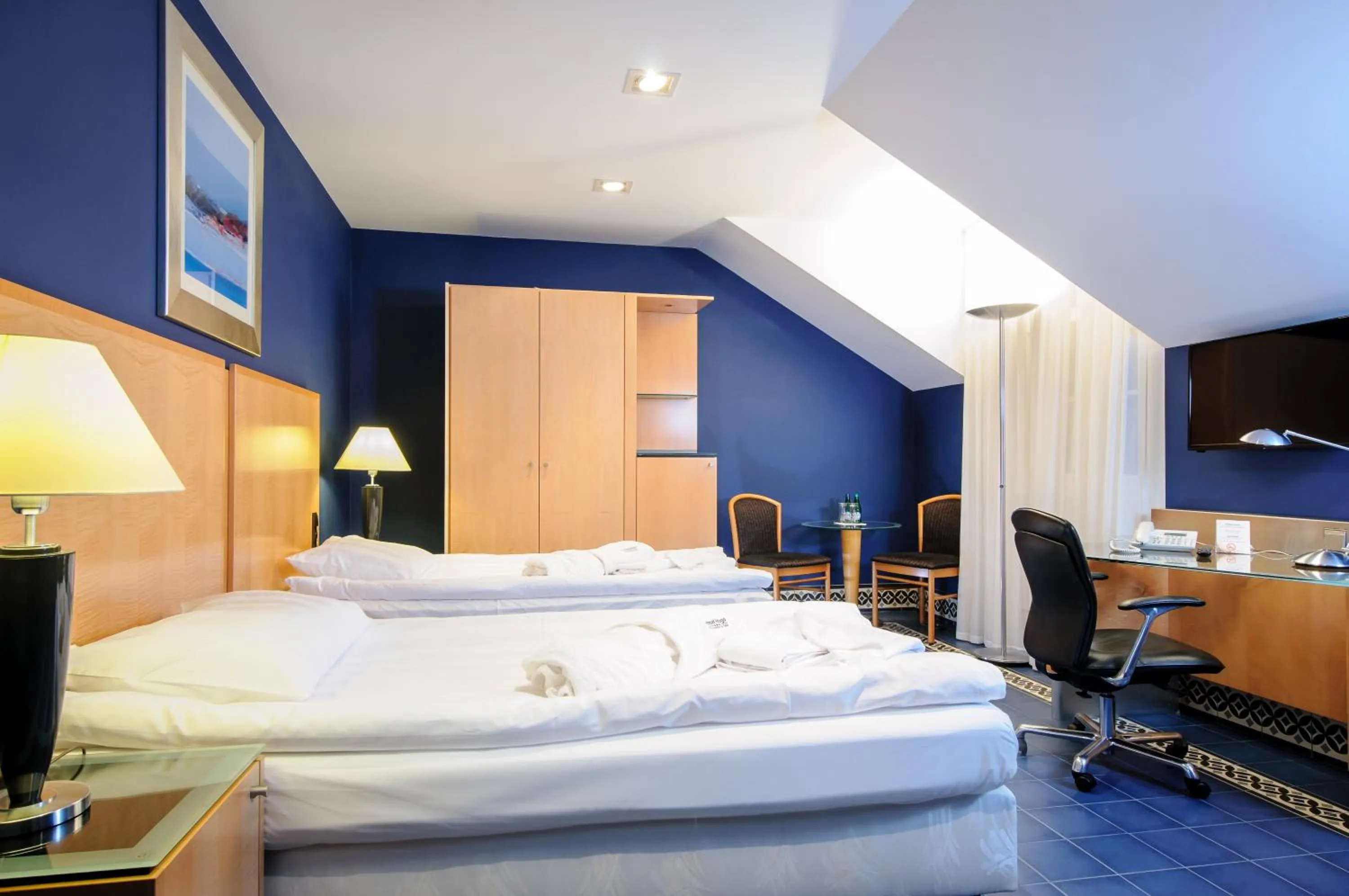 Bed in Hotel Hugo Business & Spa