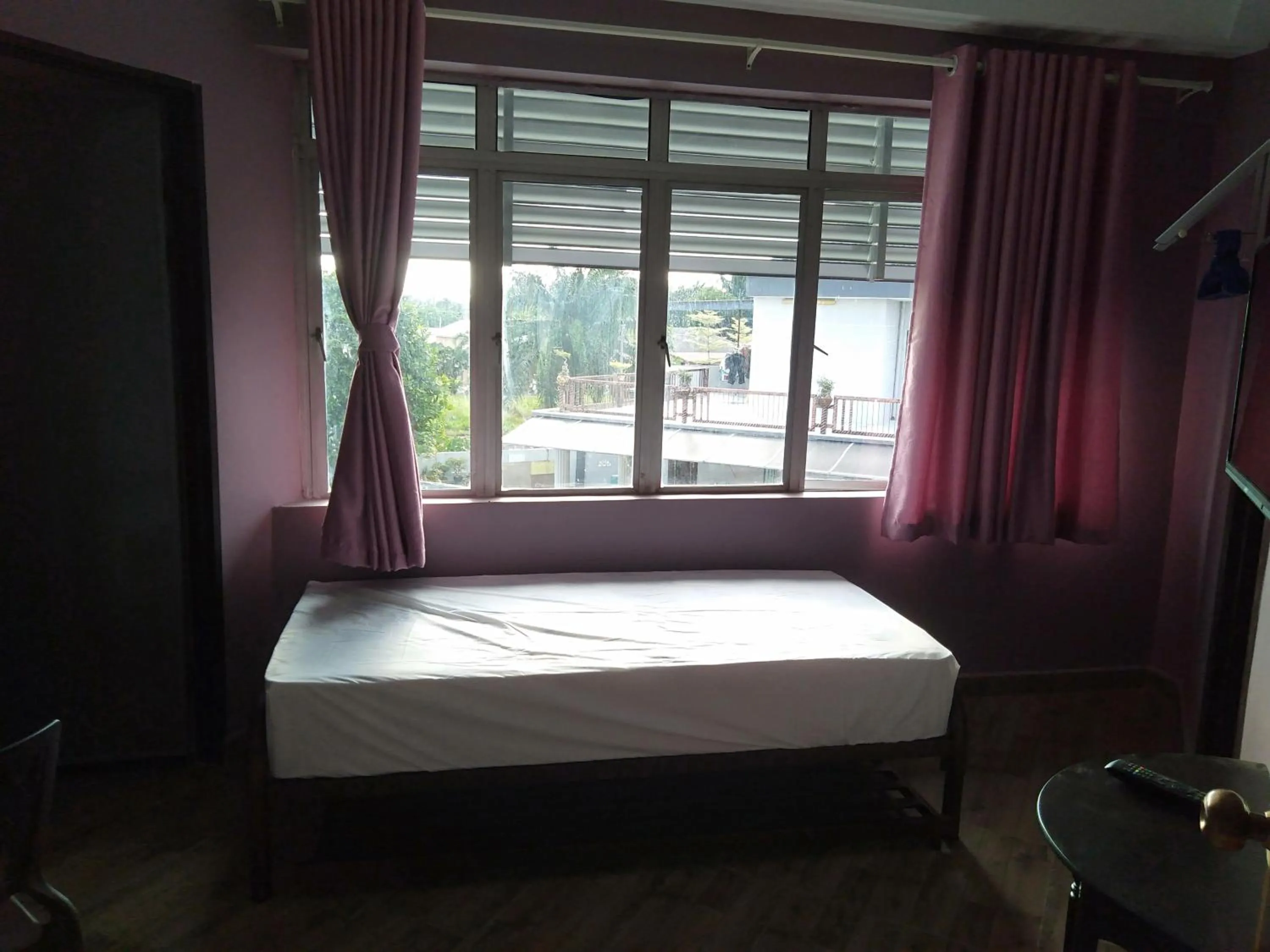Photo of the whole room, Bed in Purple Dream Home