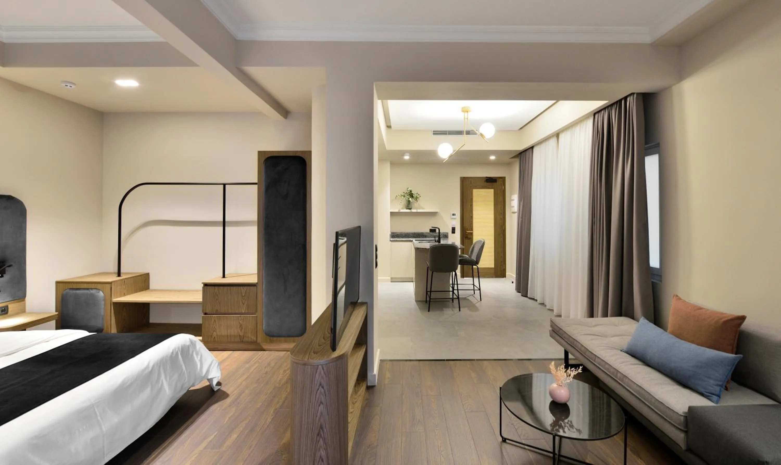 TV and multimedia, Bed in Roomore Apartments