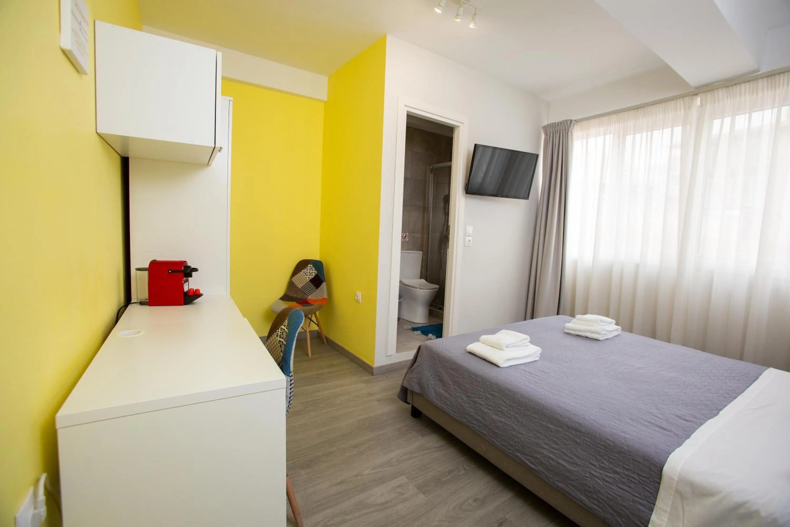 Bed in Raise Boutique Rooms in the Center of Athens