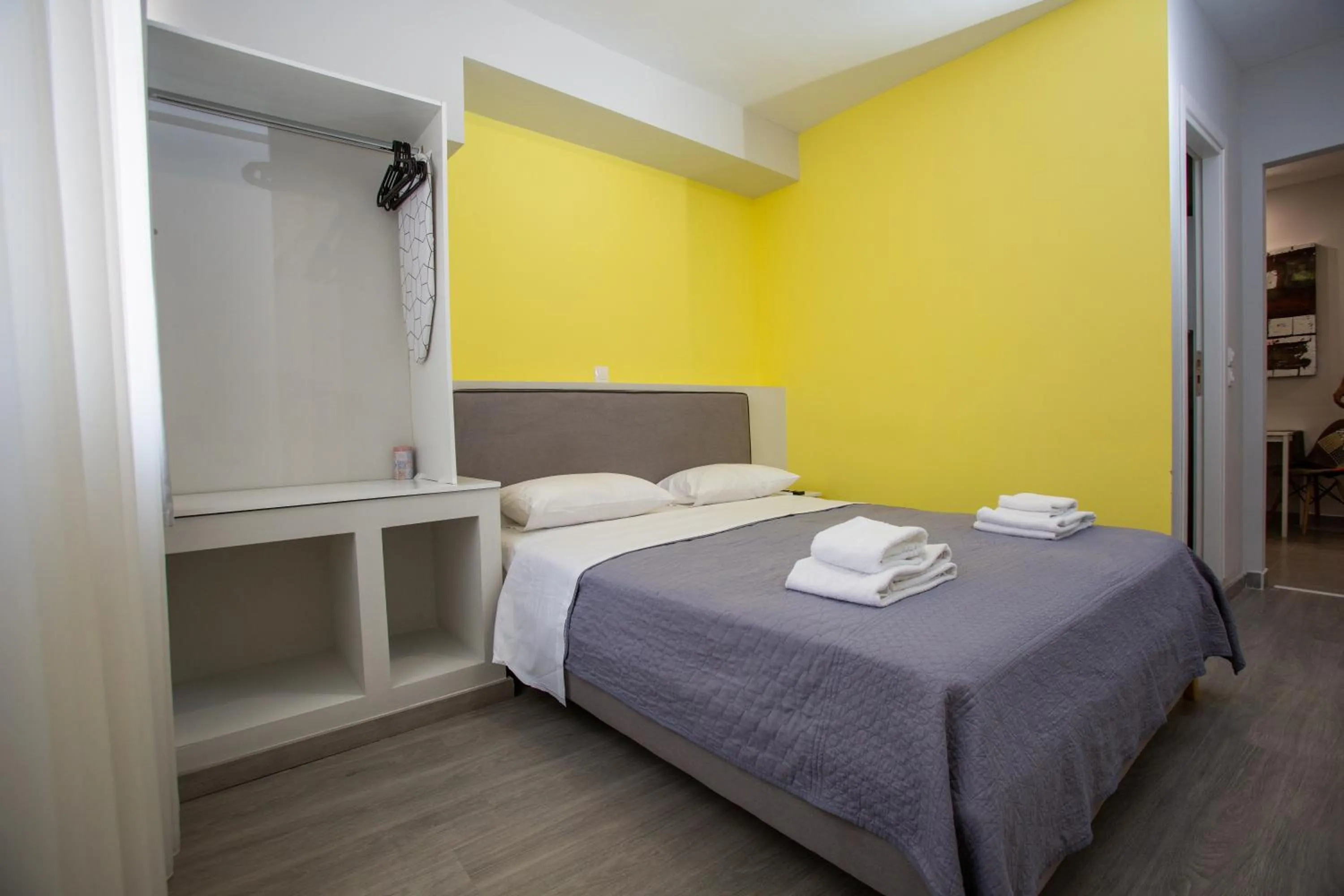 Bed in Raise Boutique Rooms in the Center of Athens