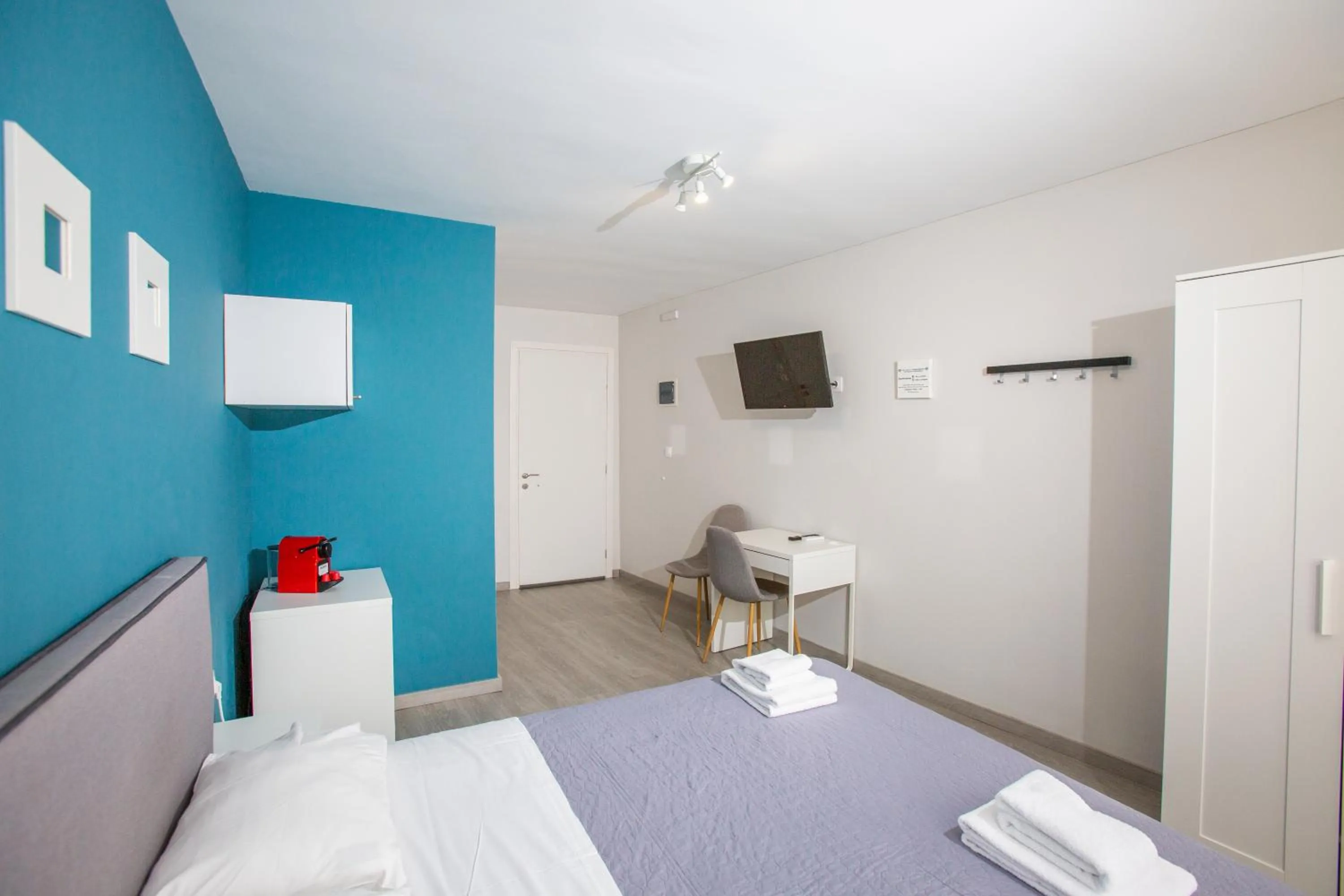 Bed in Raise Boutique Rooms in the Center of Athens