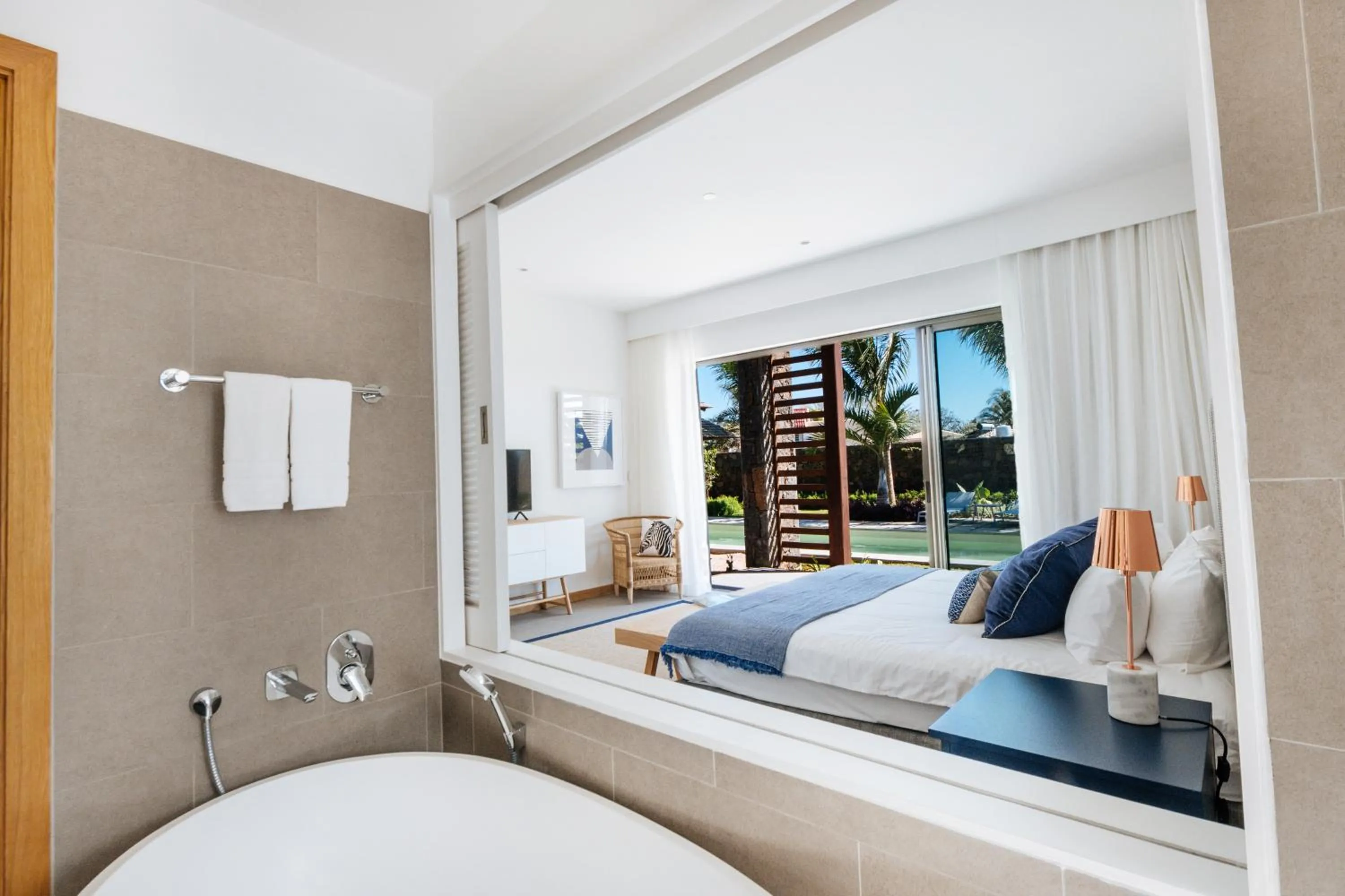 Bed in Mythic Suites & Villas by MJ Holidays