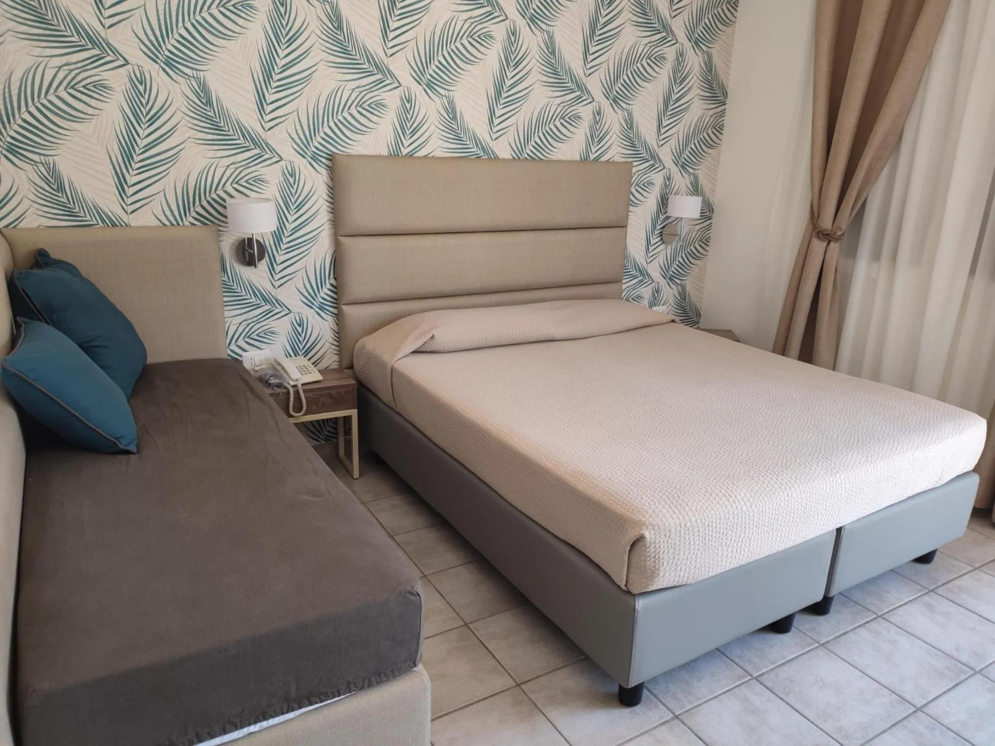 Bed in Hotel Le Palme