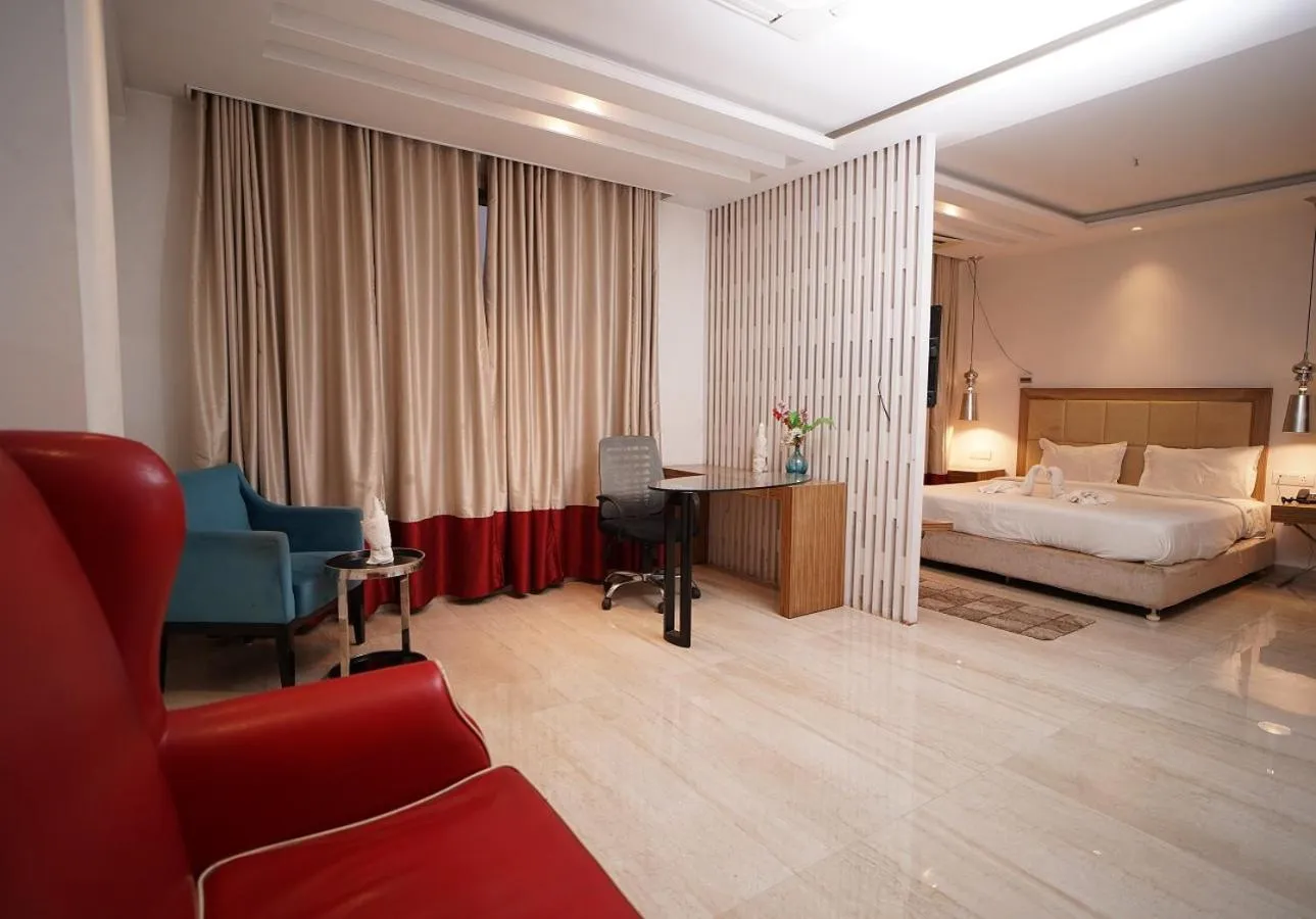 Seating area, Bed in HOTEL AMORA - Rajnandgaon