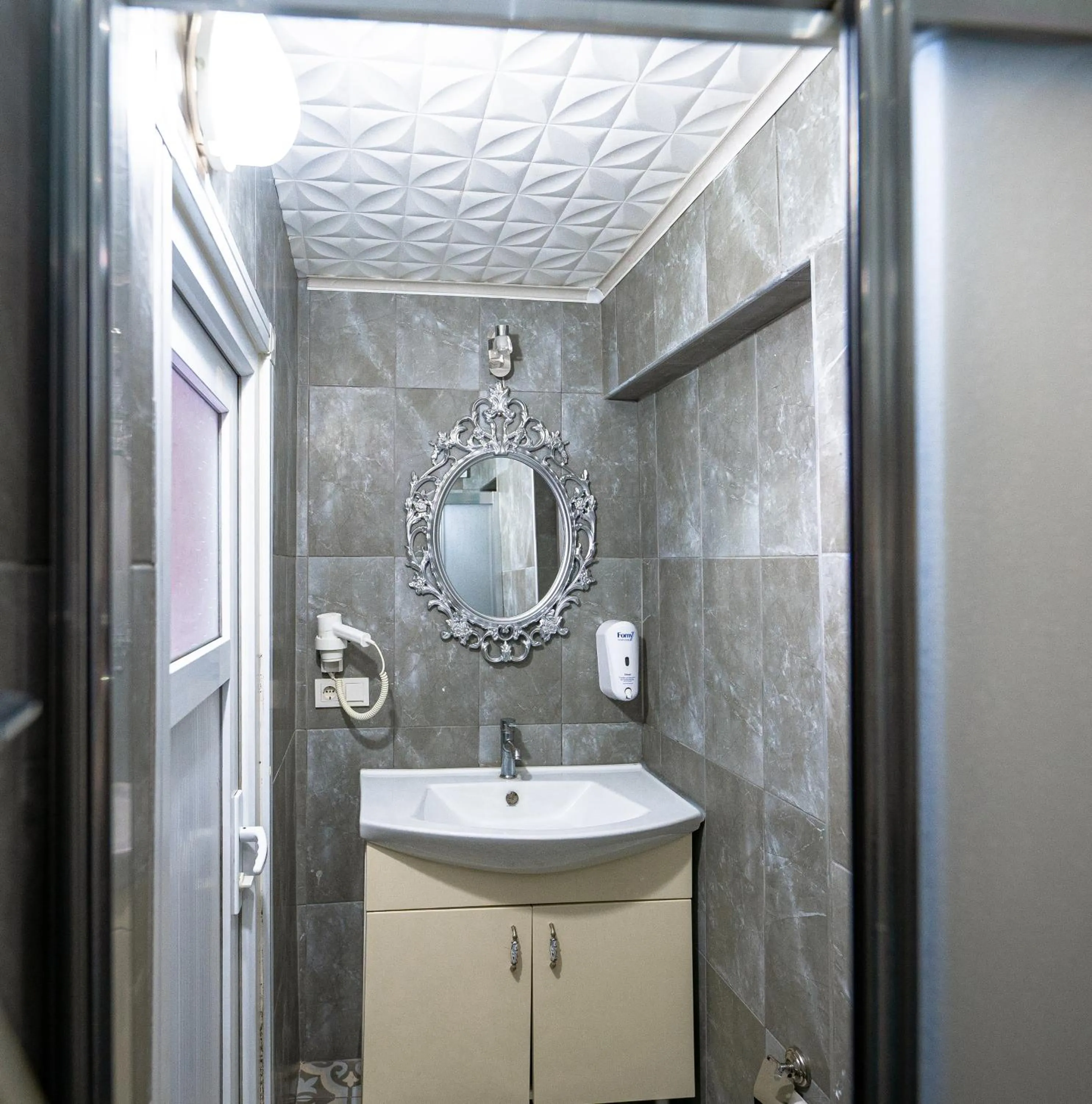 Bathroom in Evin Suit Hotel