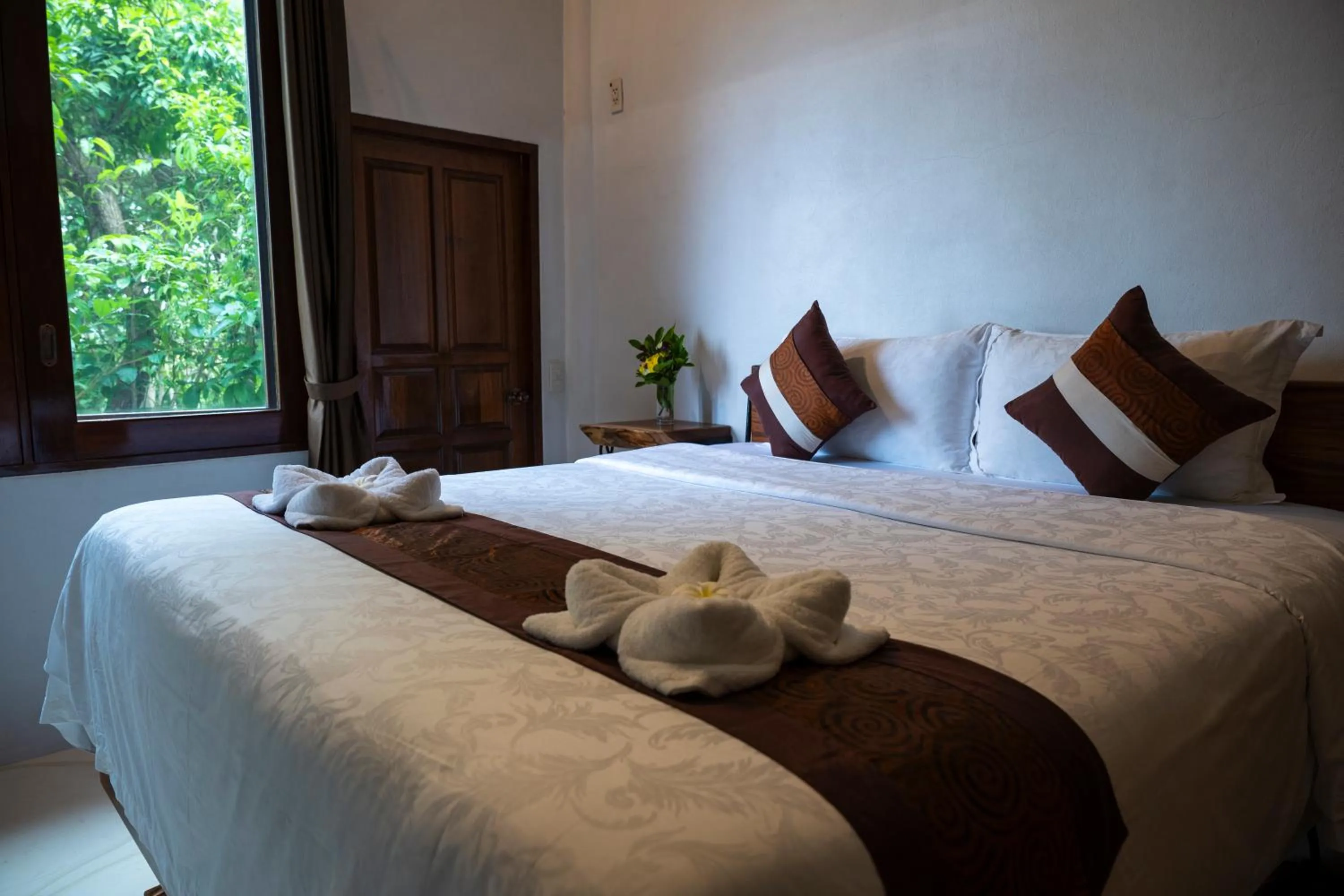Bed in Monkey Flower Villas