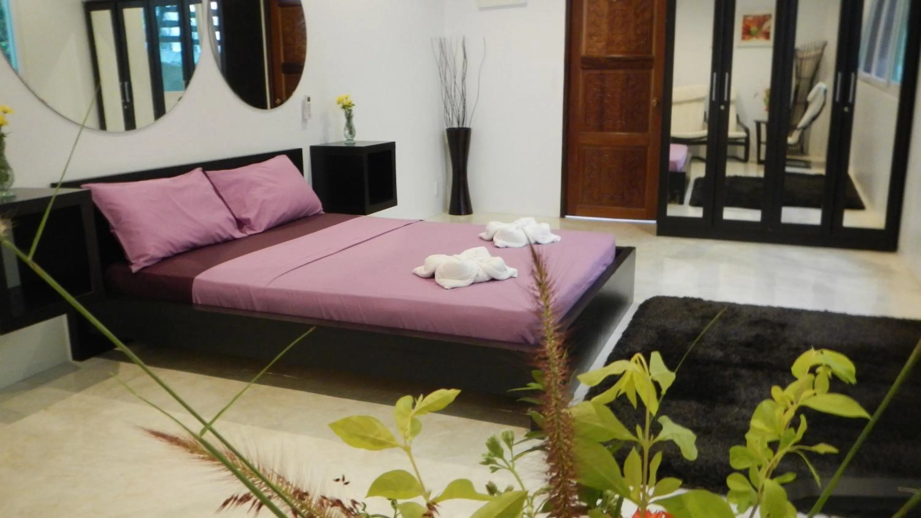 Bed in Monkey Flower Villas