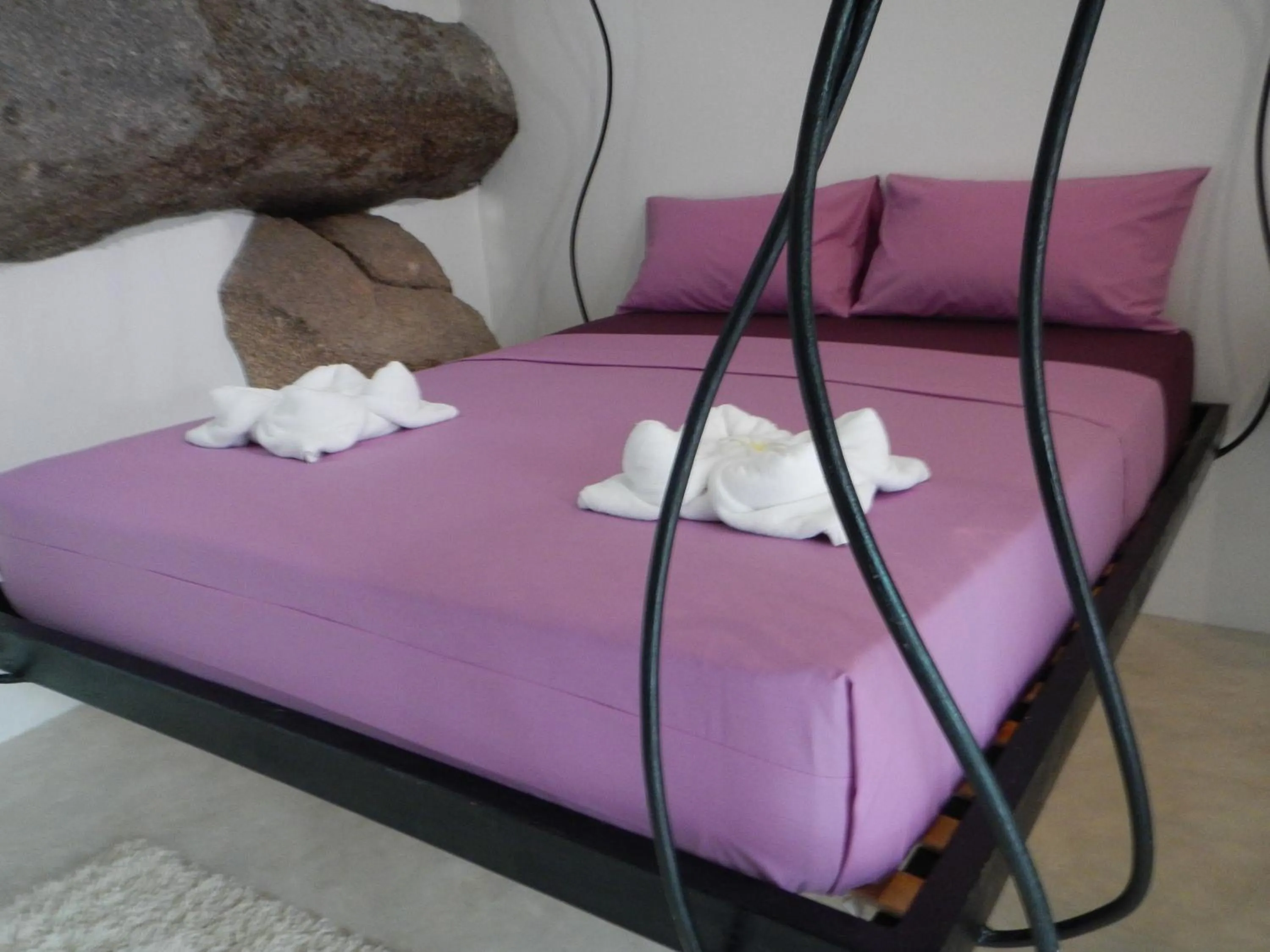 Bed in Monkey Flower Villas