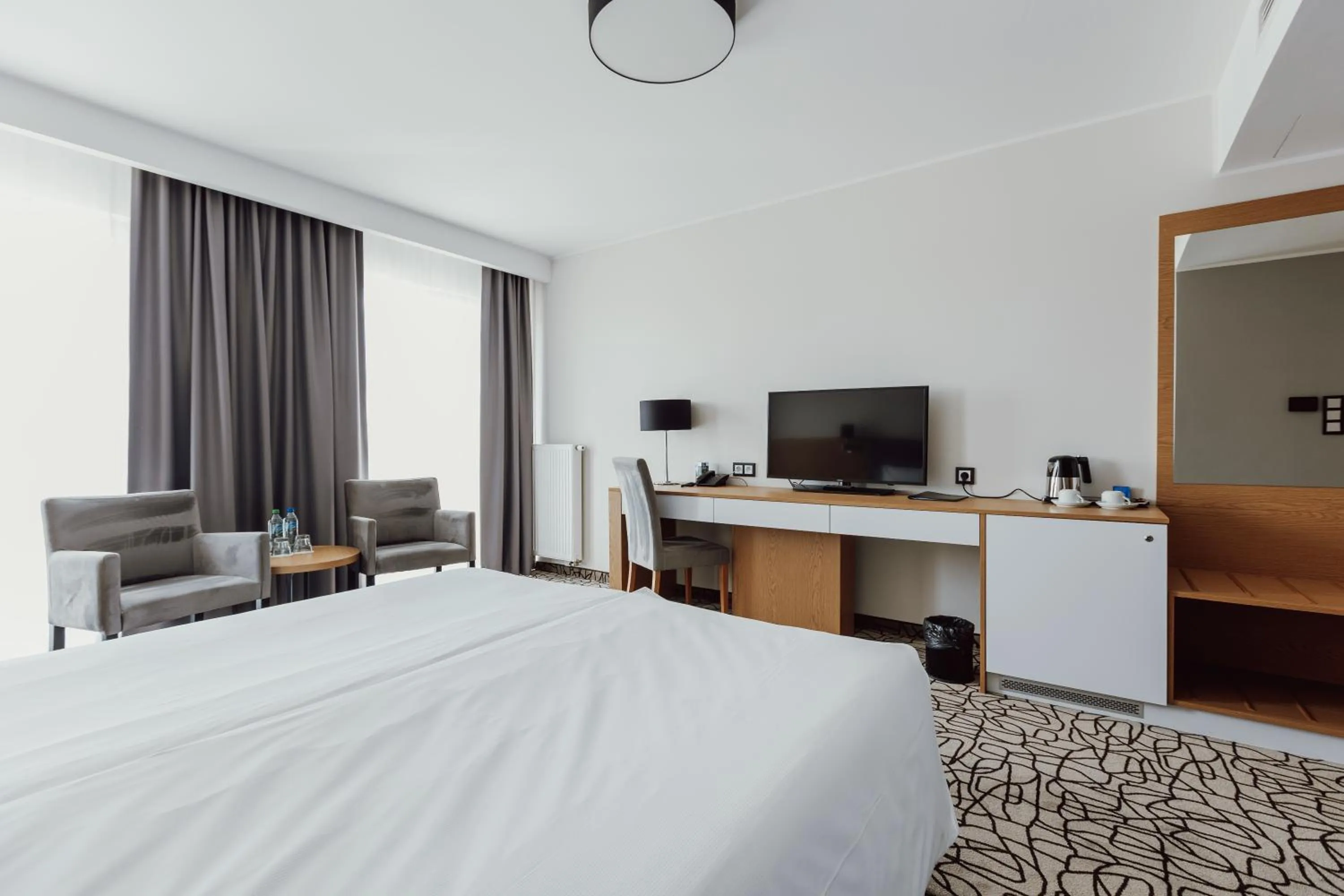 Communal lounge/ TV room, Bed in Aparthotel Termy Uniejów