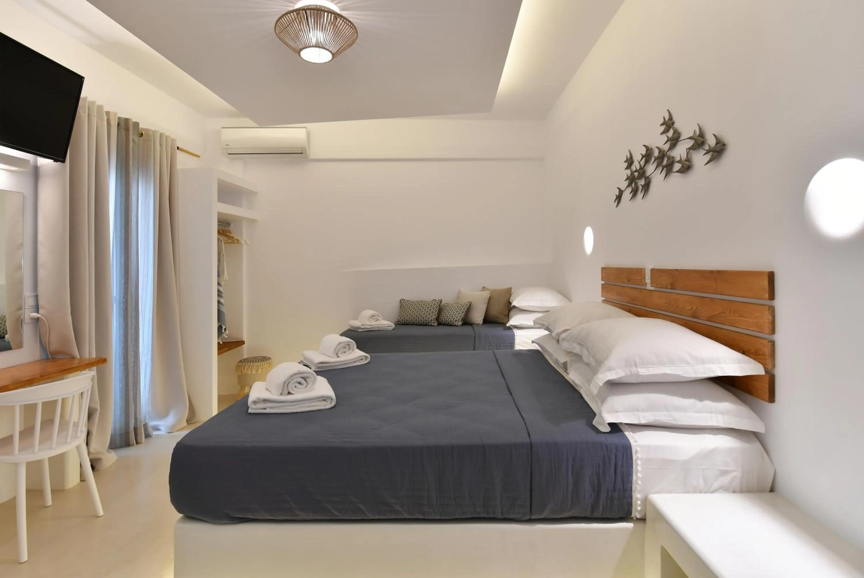 Bed in Ammos Luxury Rooms & Home