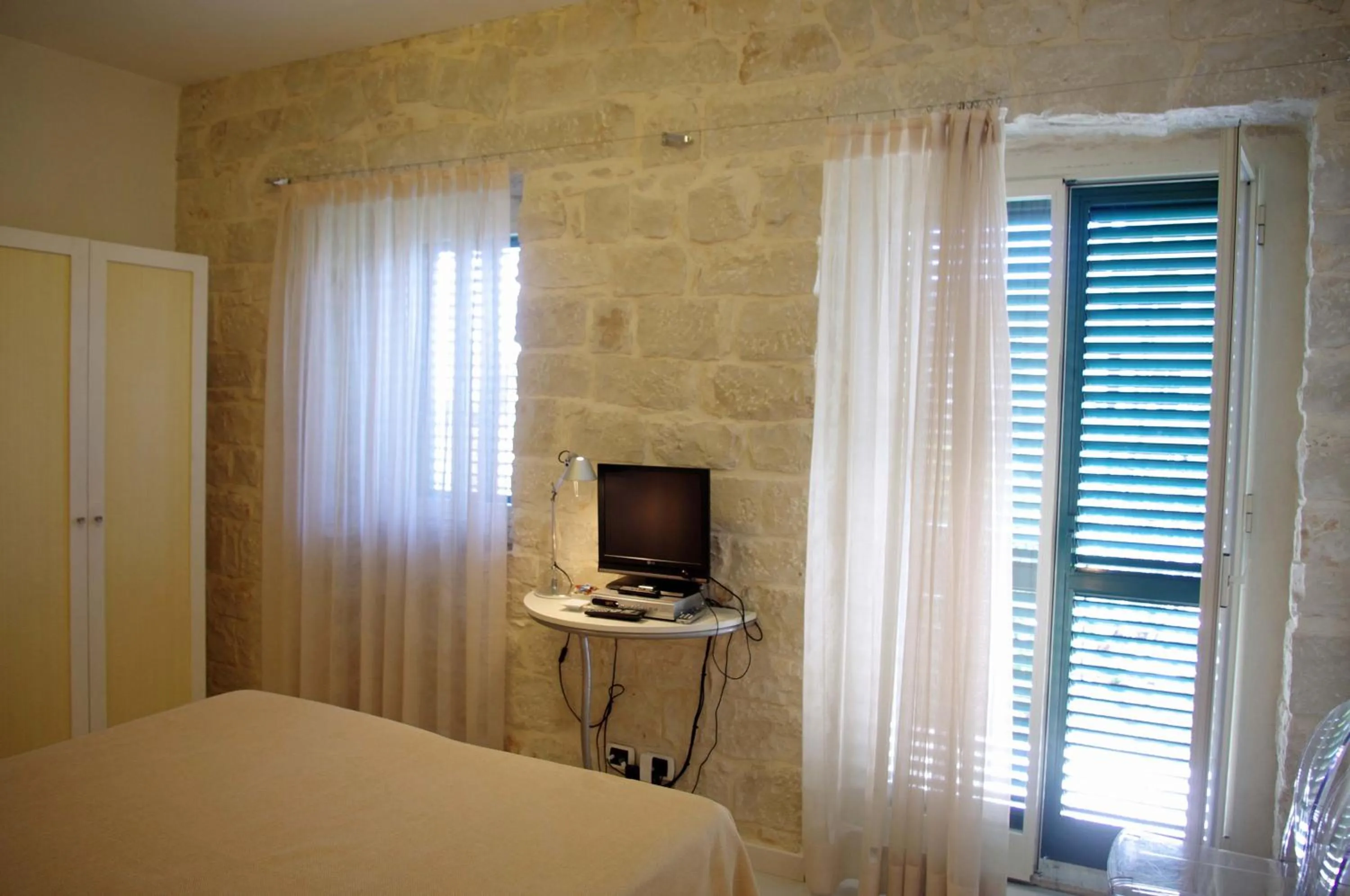 Photo of the whole room, Bed in La Piccola Locanda