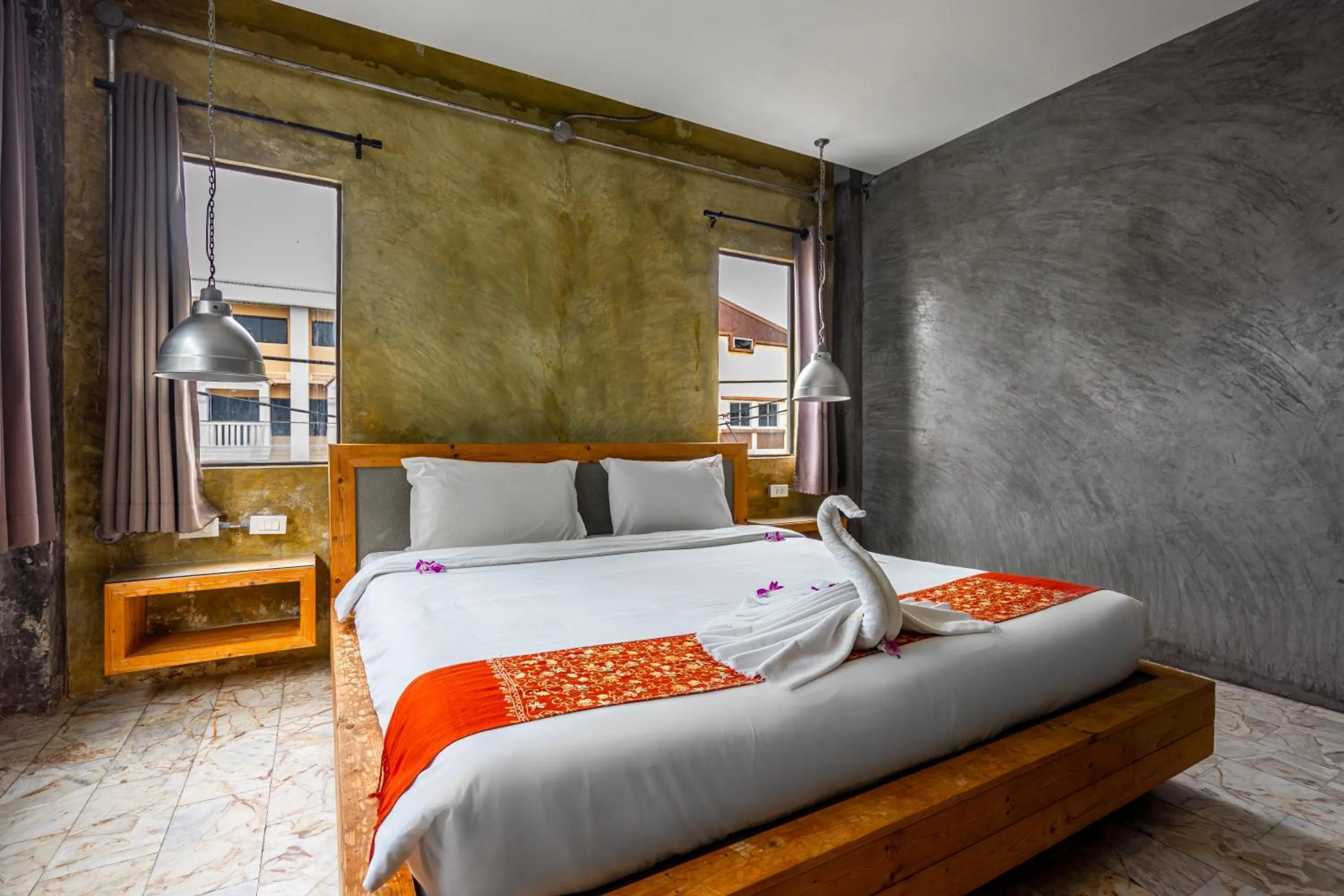 Bed in UNOTEL Karon Beach