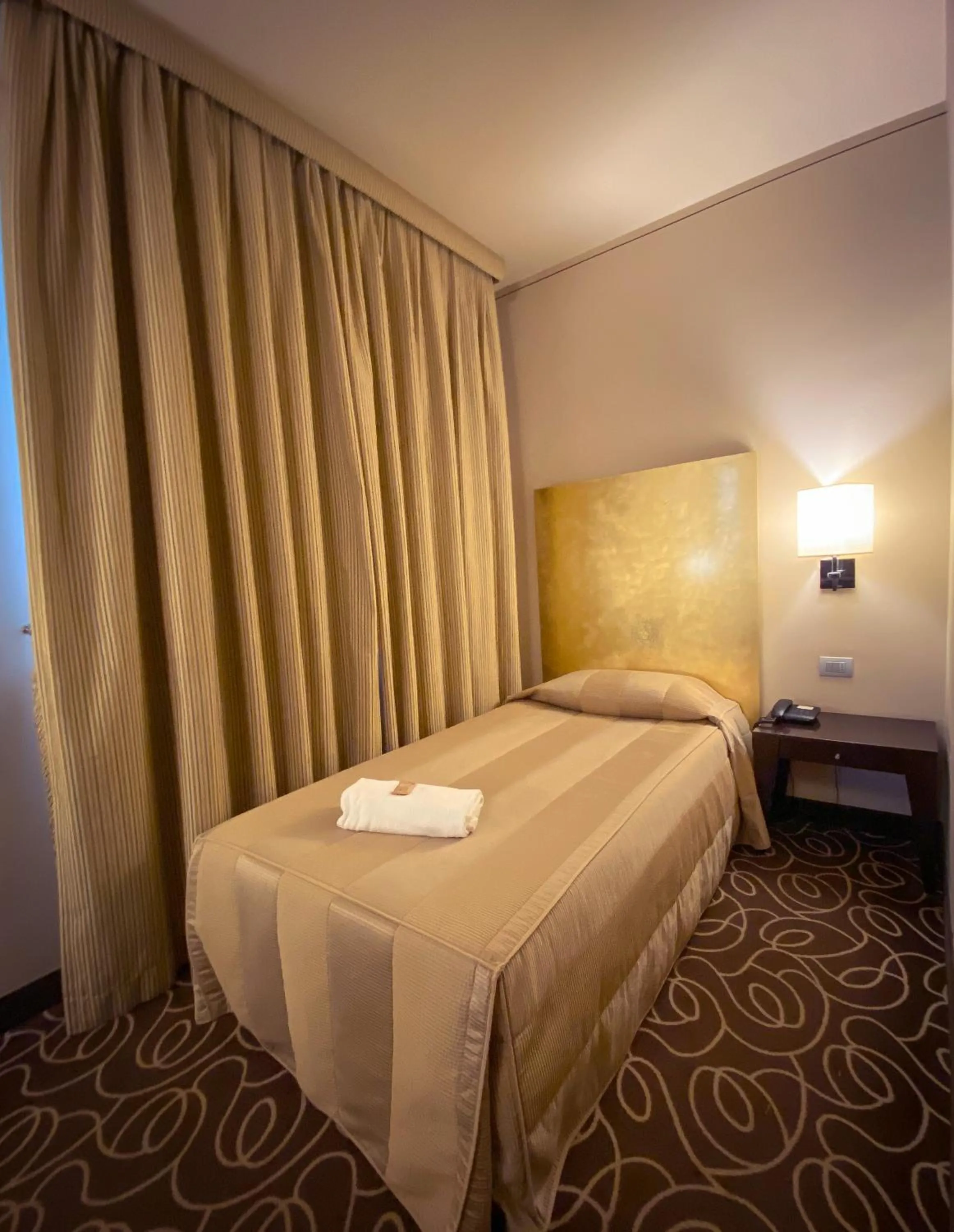 Bed in Hotel Riviera