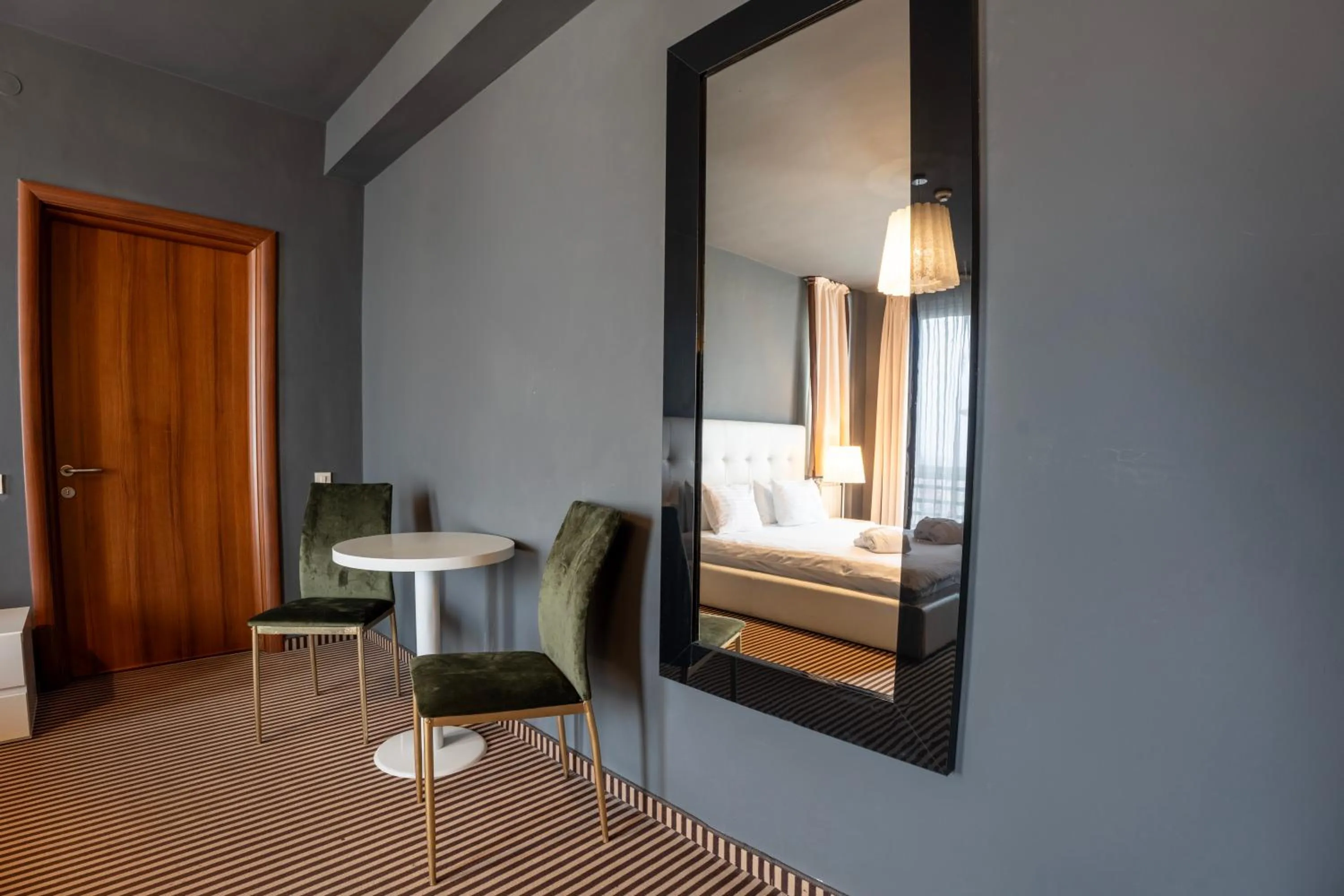 Seating area, Bed in Alex&George Boutique Hotel