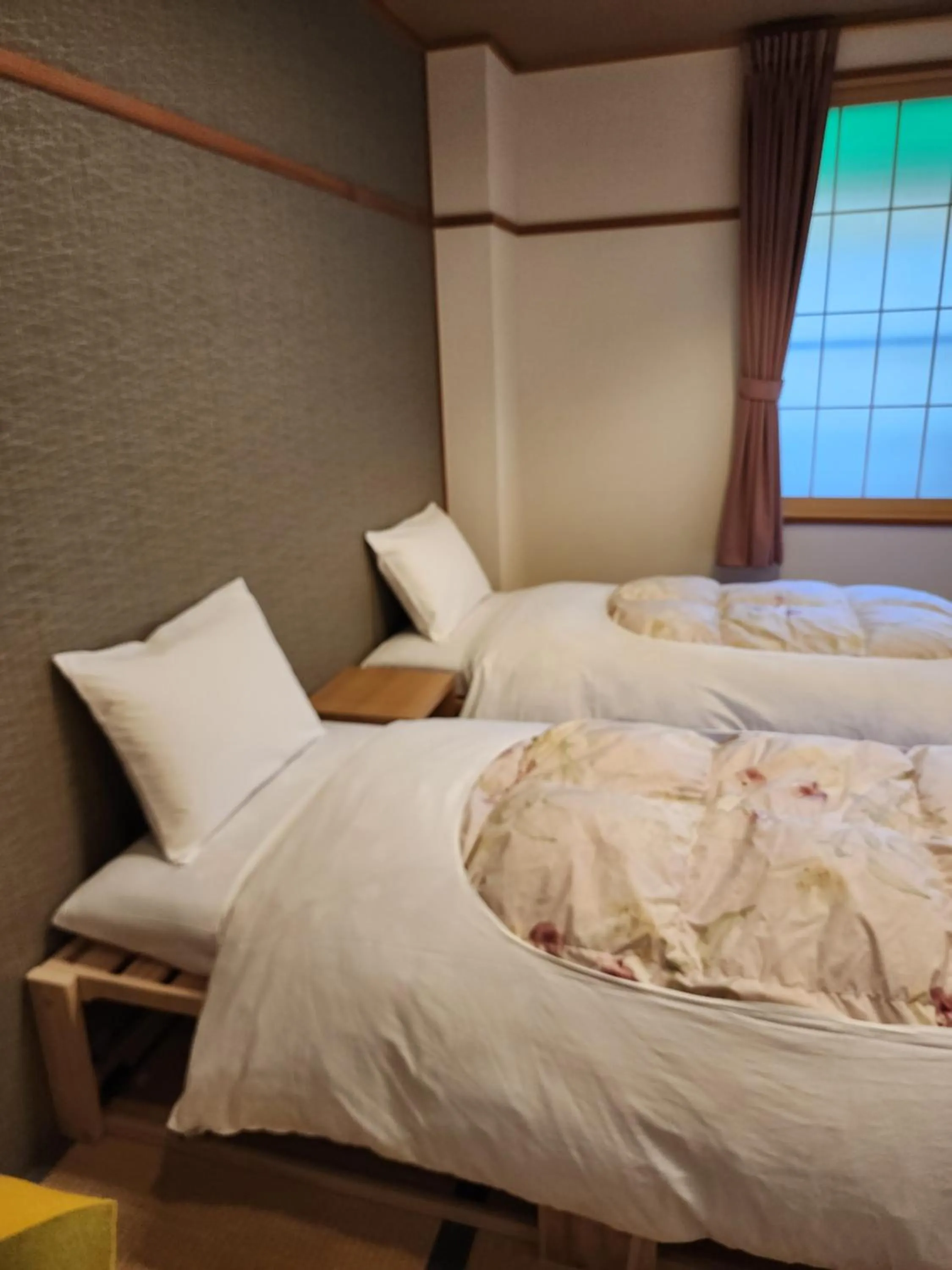 Bed in Hakuba Hotel Hana-no-Sato