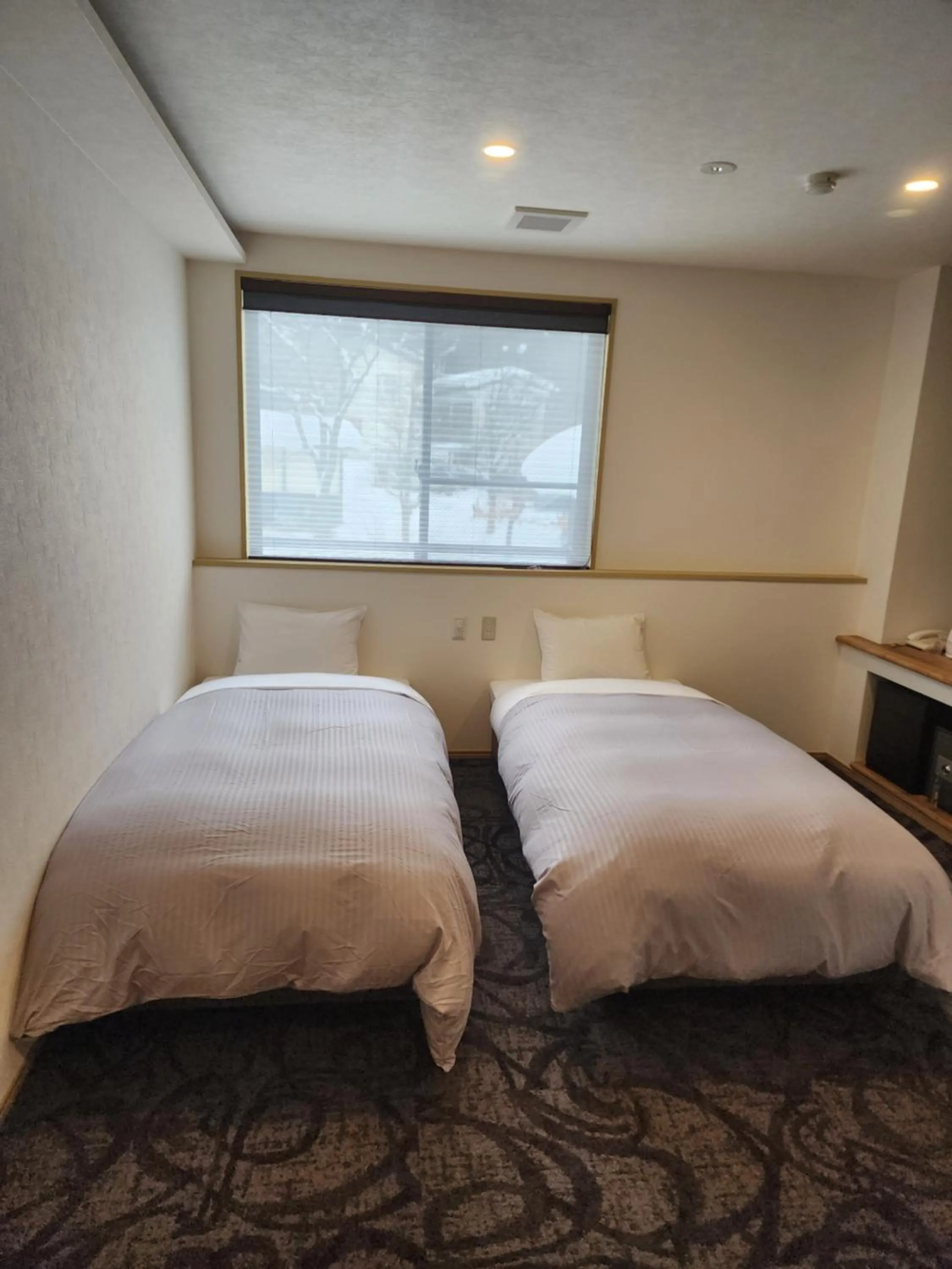 Bed in Hakuba Hotel Hana-no-Sato