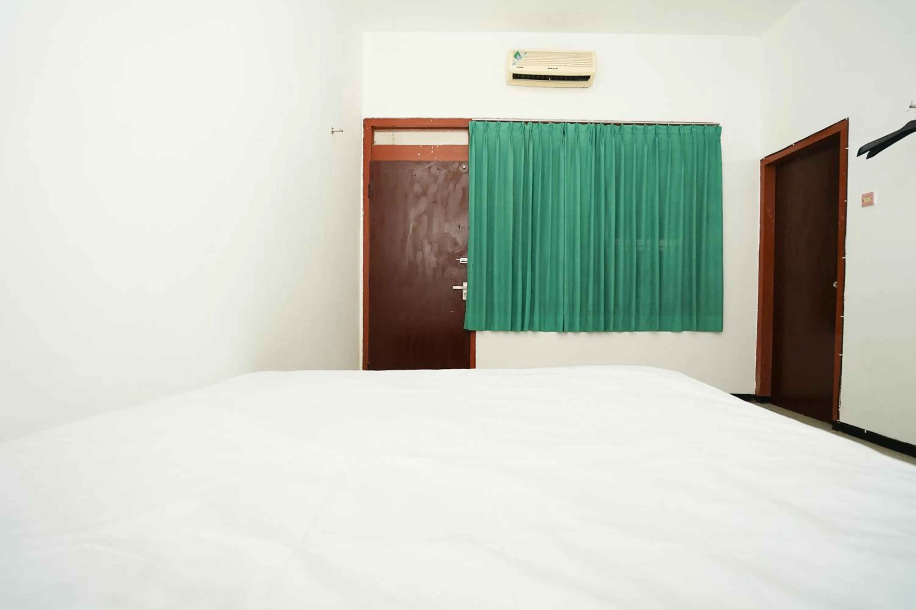 Bedroom, Bed in Merapi Inn Syariah by ecommerceloka
