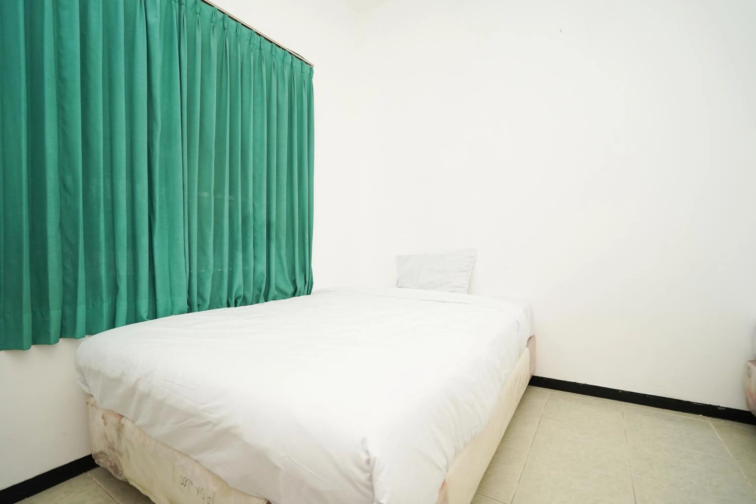 Bedroom, Bed in Merapi Inn Syariah by ecommerceloka