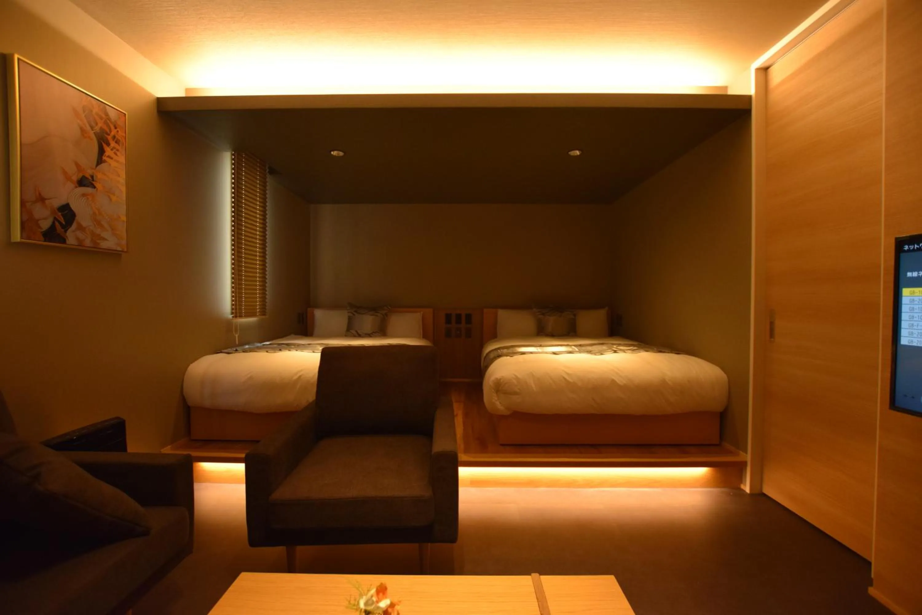 Photo of the whole room, Bed in GRAND BASE Beppu Ekimae